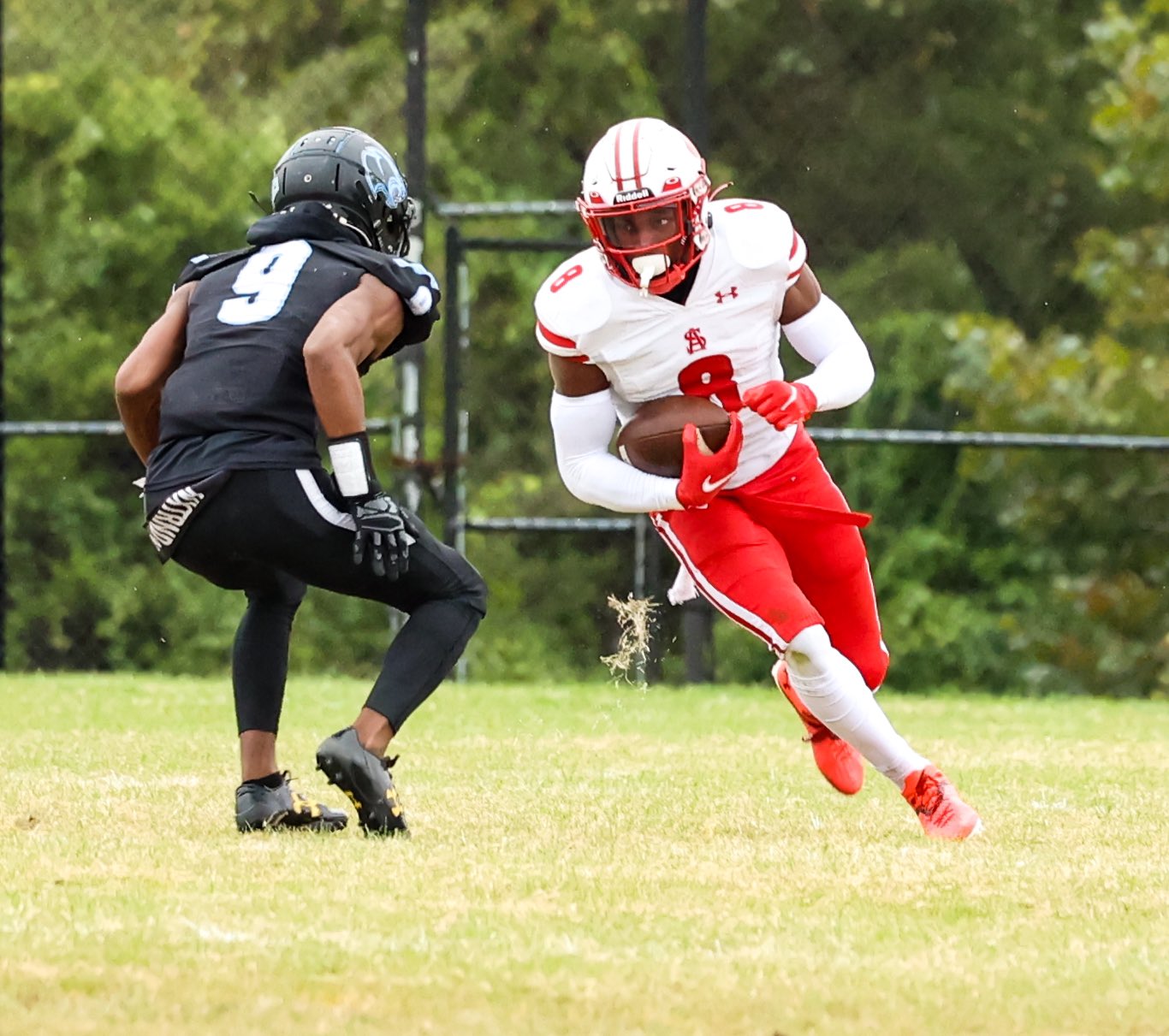 Spalding's Max Moss is defended by Pallotti's Iggy Williams during Friday's MIAA A Conference football contest in Laurel.
