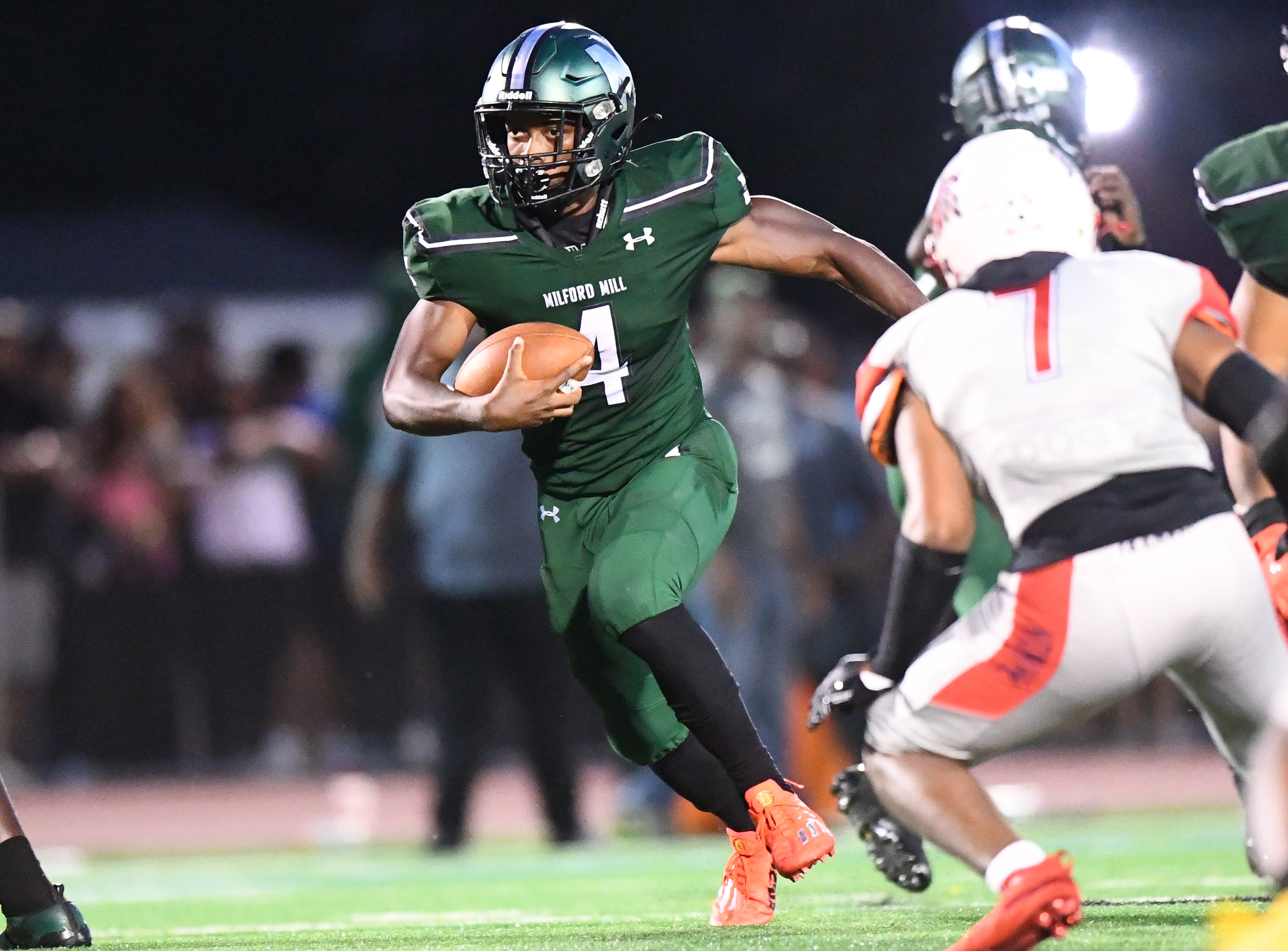 Milford Mill's Sean Williams bursts through a hole in the Franklin defense for a nice gain.