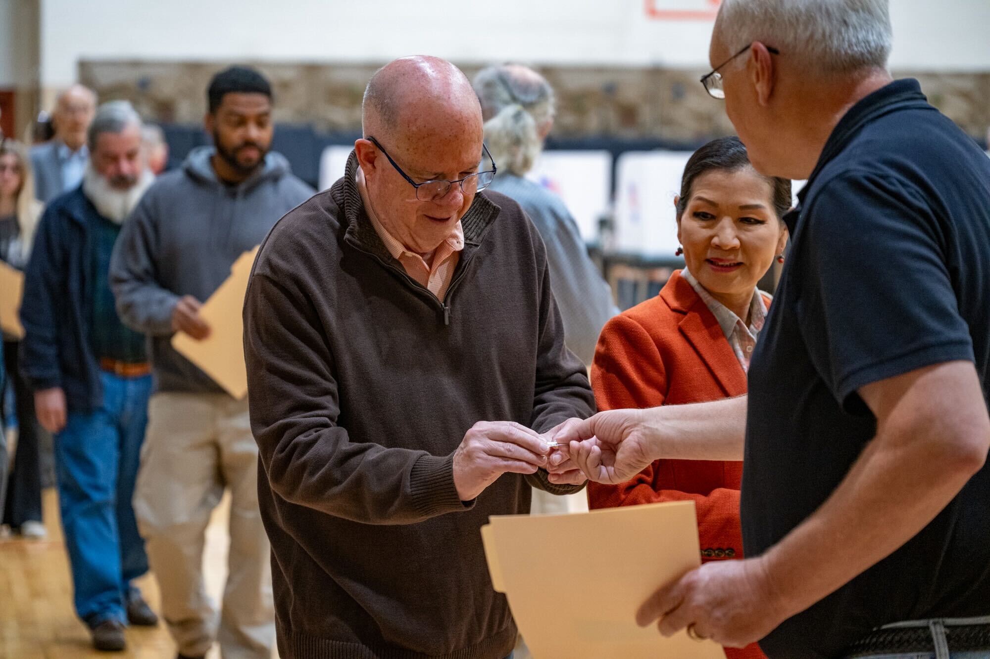 Former Gov. Larry Hogan votes with his wife Yumi at Davidsonville Elementary on Monday, November 4, 2024.