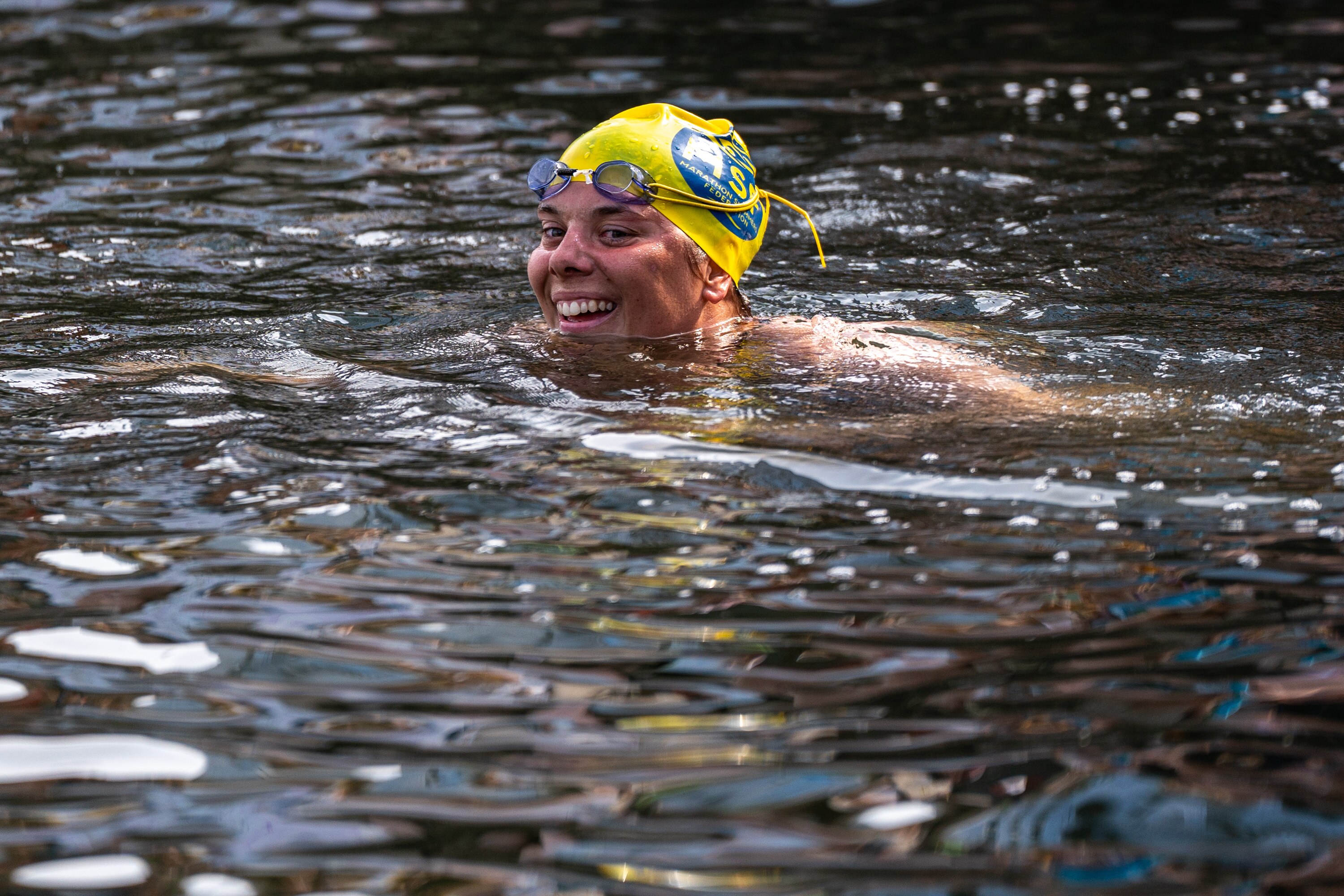 Katie Humphrey grins after completing her 24-mile journey at the Inner Harbor last year.