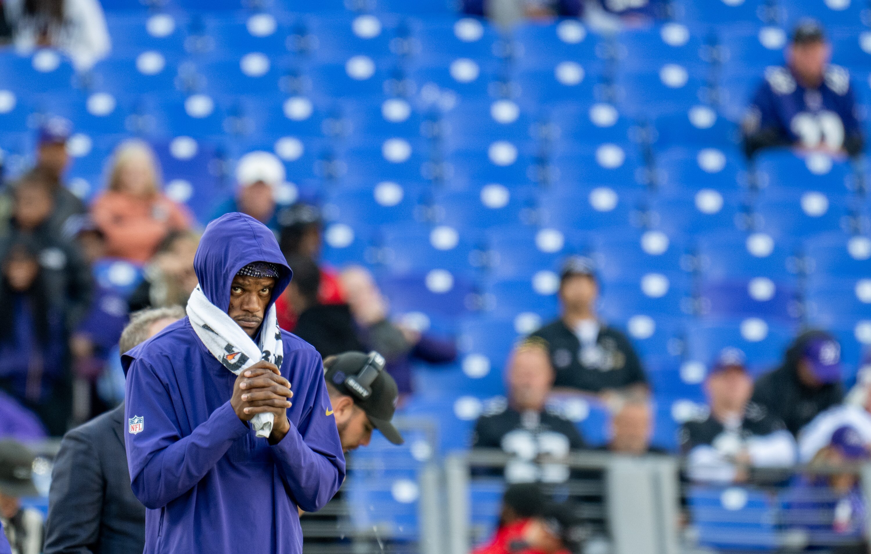 Baltimore Ravens quarterback Lamar Jackson watches from the sidelines as the clock winds down in the fourth quarter of a 35-13 loss to the Cincinnati Bengals. Jackson has missed three straight games with an ankle injury. 