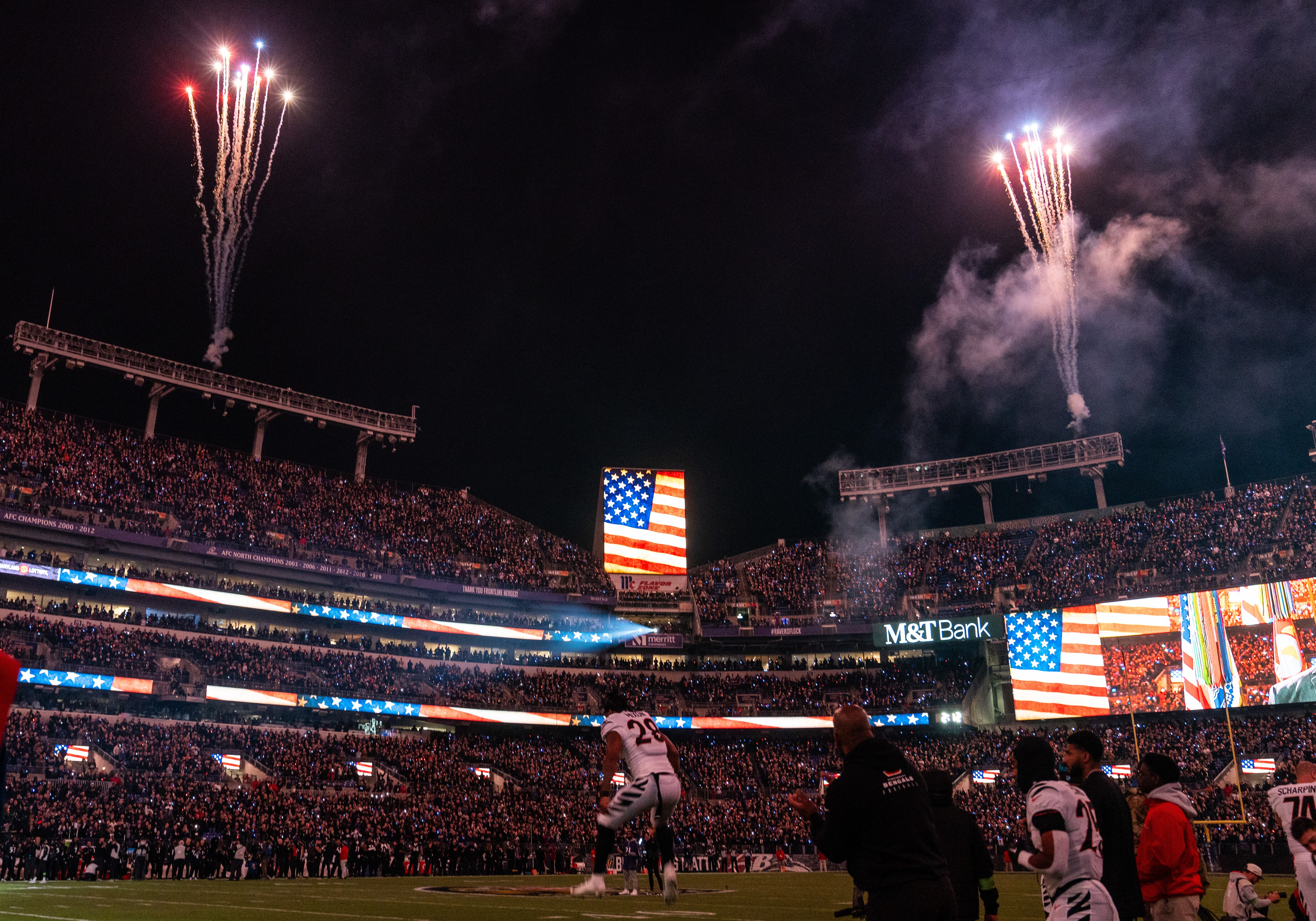 Fireworks go off during the national anthem before the Baltimore Ravens game against the Cincinnati Bengals at M&T Bank Stadium on Thursday, Nov. 16, 2023.