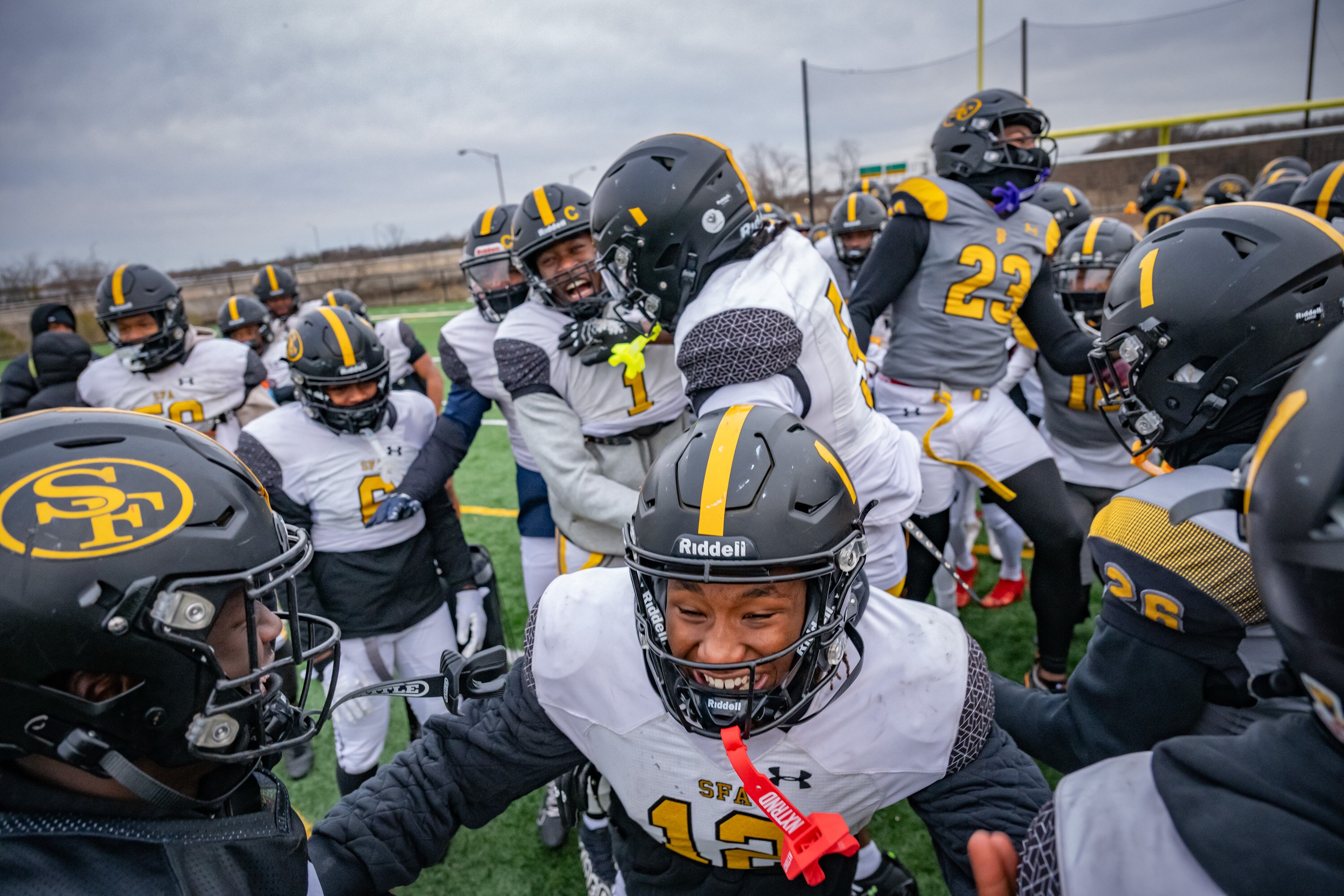 Saint Frances Academy football players get hyped up before practice on a bitterly cold afternoon at Middle Branch Fitness and Wellness Center.