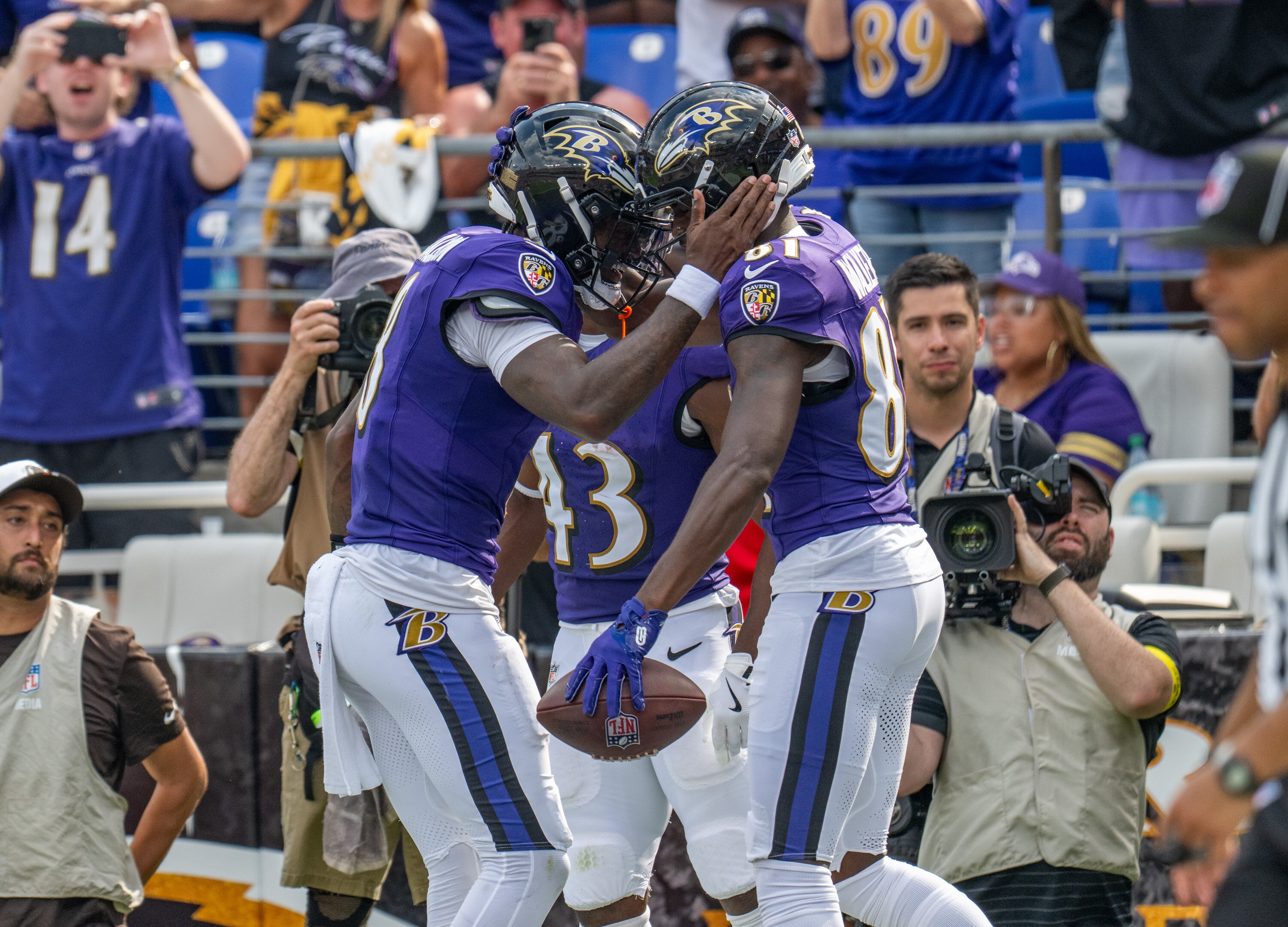 Ravens quarterback Lamar Jackson, left, celebrates with wide receiver Devontez Walker after a touchdown in the fourth quarter.
