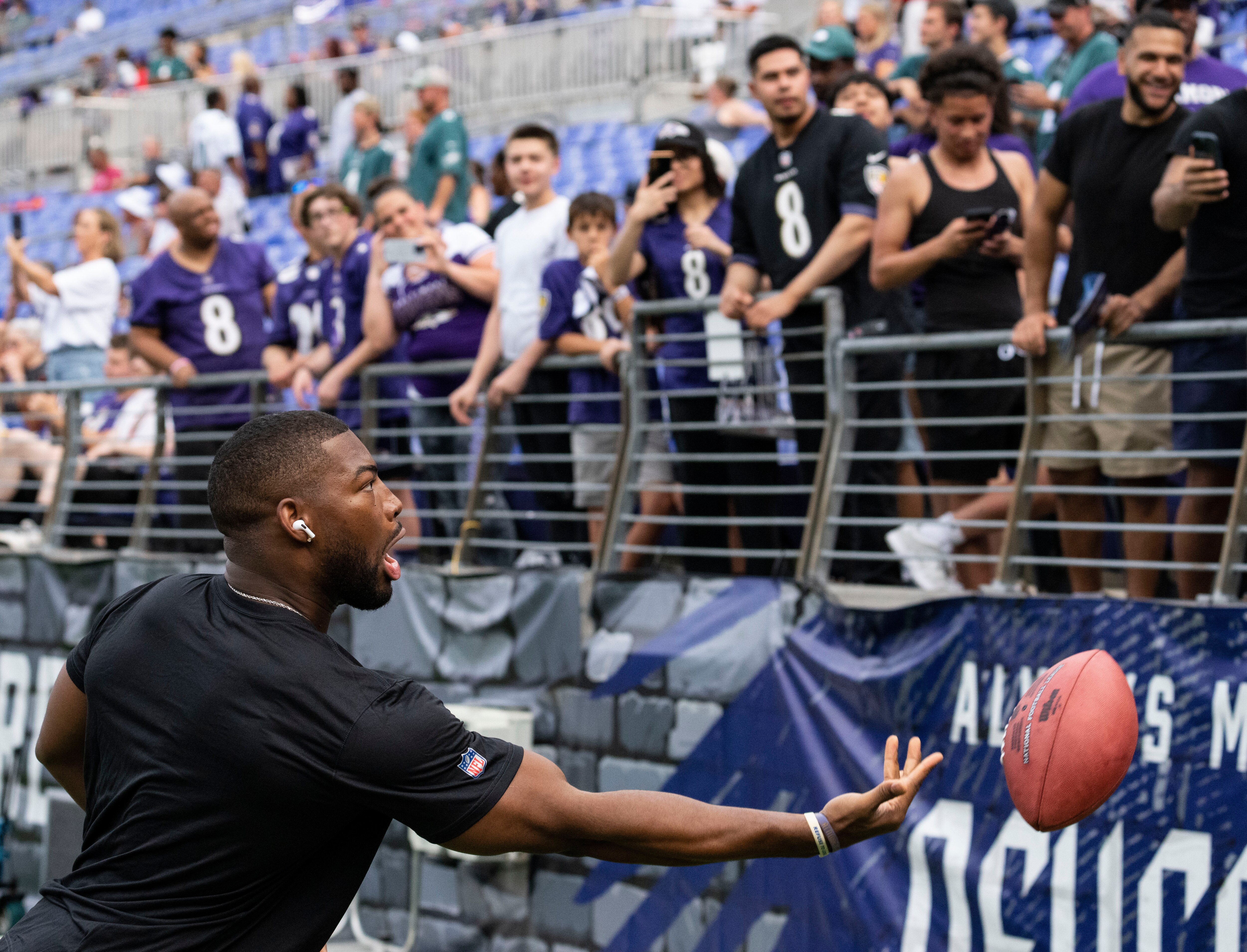 Raven’s Tyrus Bowser throws the ball with fans during warms up before a preseason game against the Philadelphia Eagles at M&T Bank Stadium on Saturday, August 12, 2023.
