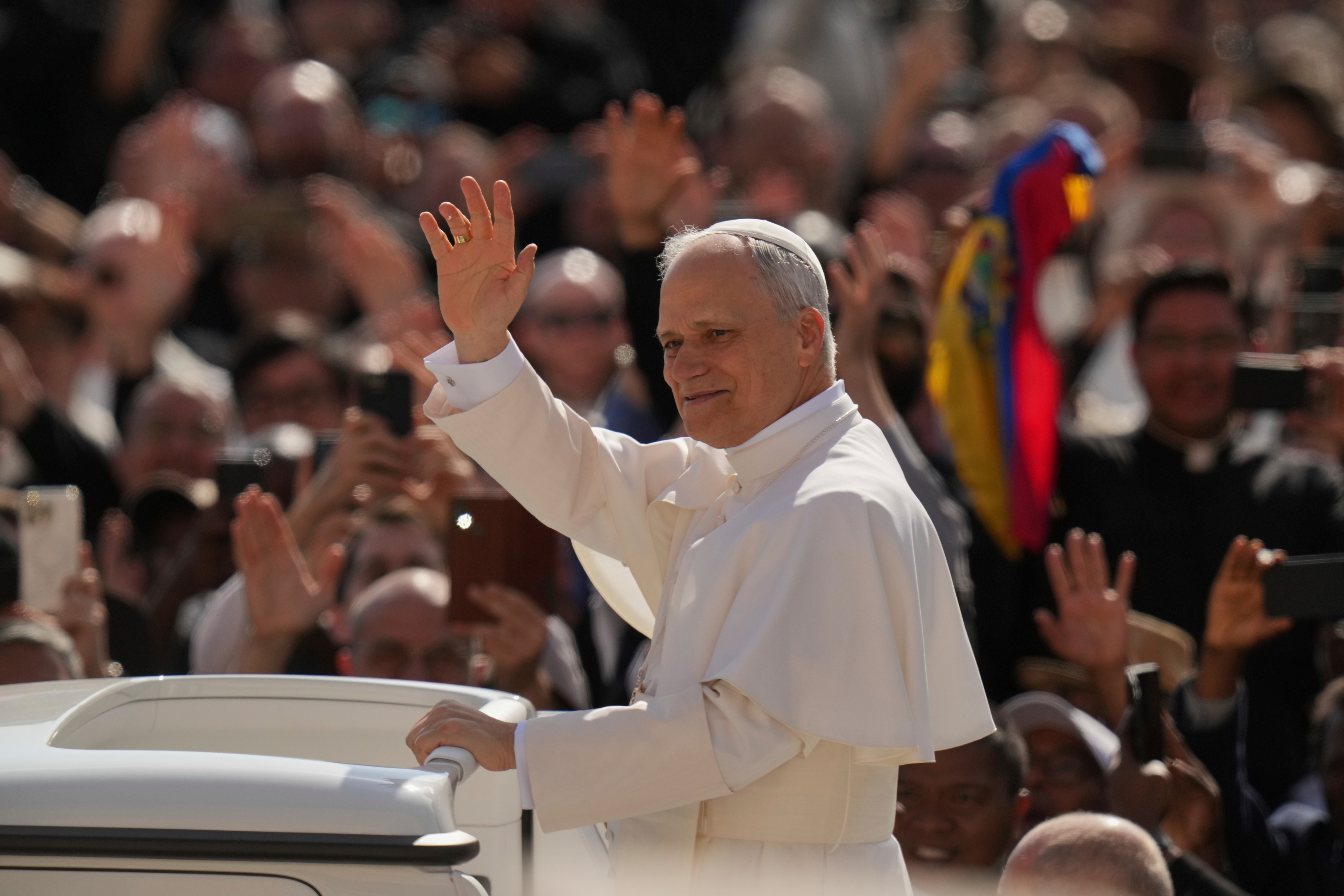 Pope Leo XIV's waves to people before his formal inauguration of his pontificate with a Mass in St. Peter's Square attended by heads of state, royalty and ordinary faithful, Sunday, May 18, 2025.