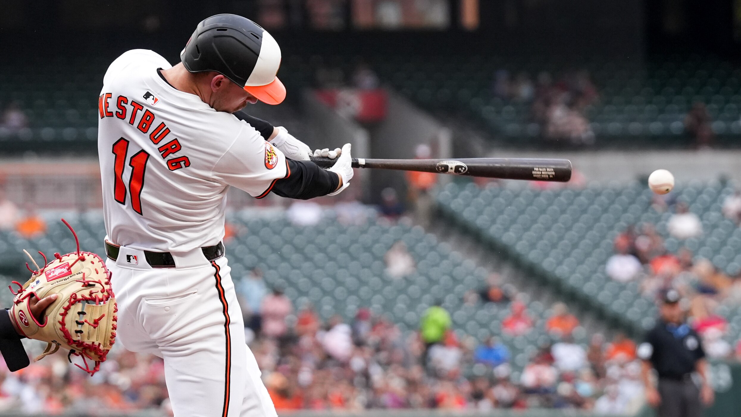 Baltimore Orioles third baseman Jordan Westburg (11) connects with a pitch during the second game of a series against the Cleveland Guardians at Camden Yards on June 25.