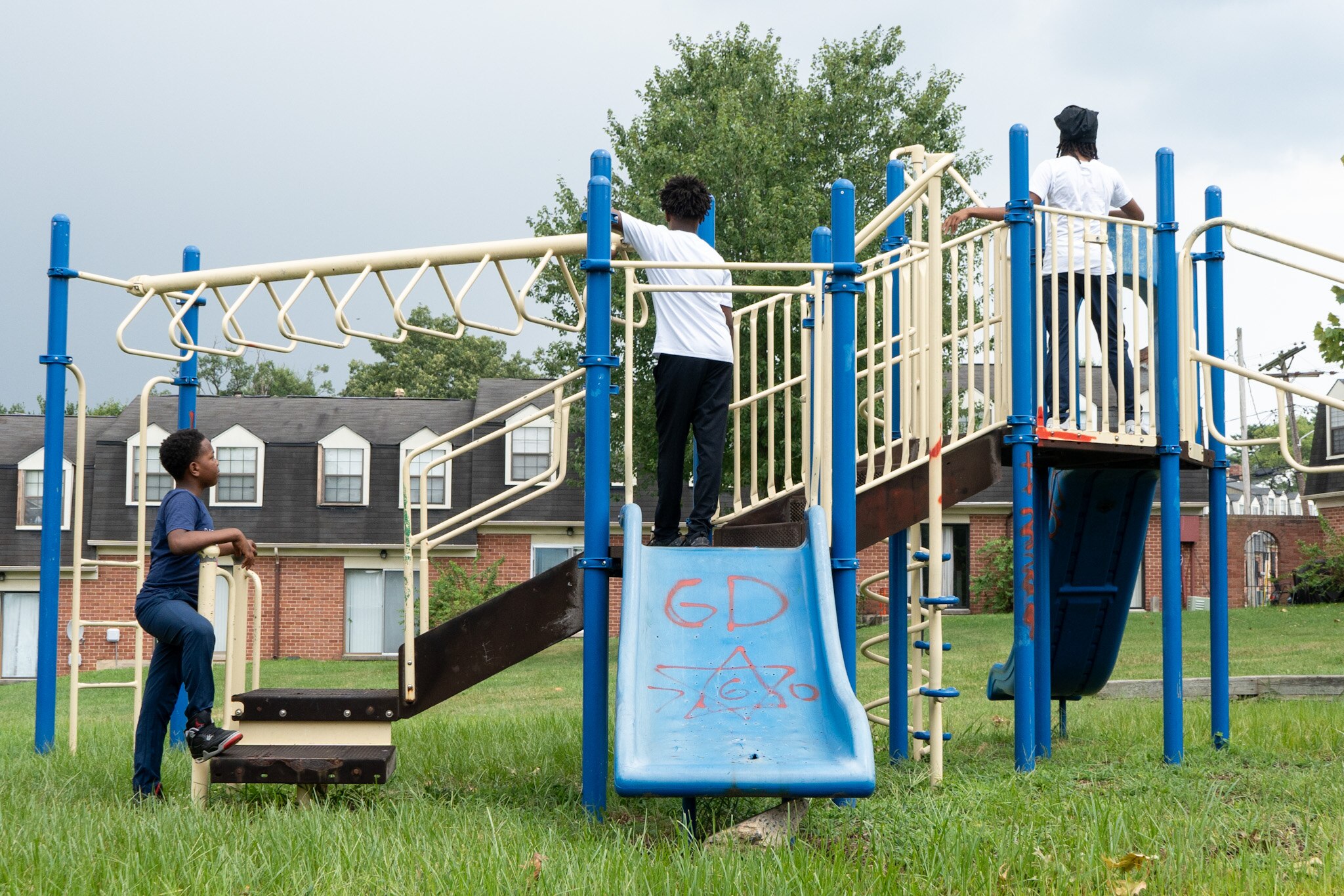 Neighborhood children enjoy a playground at Dutch Village apartments in Northeast Baltimore.