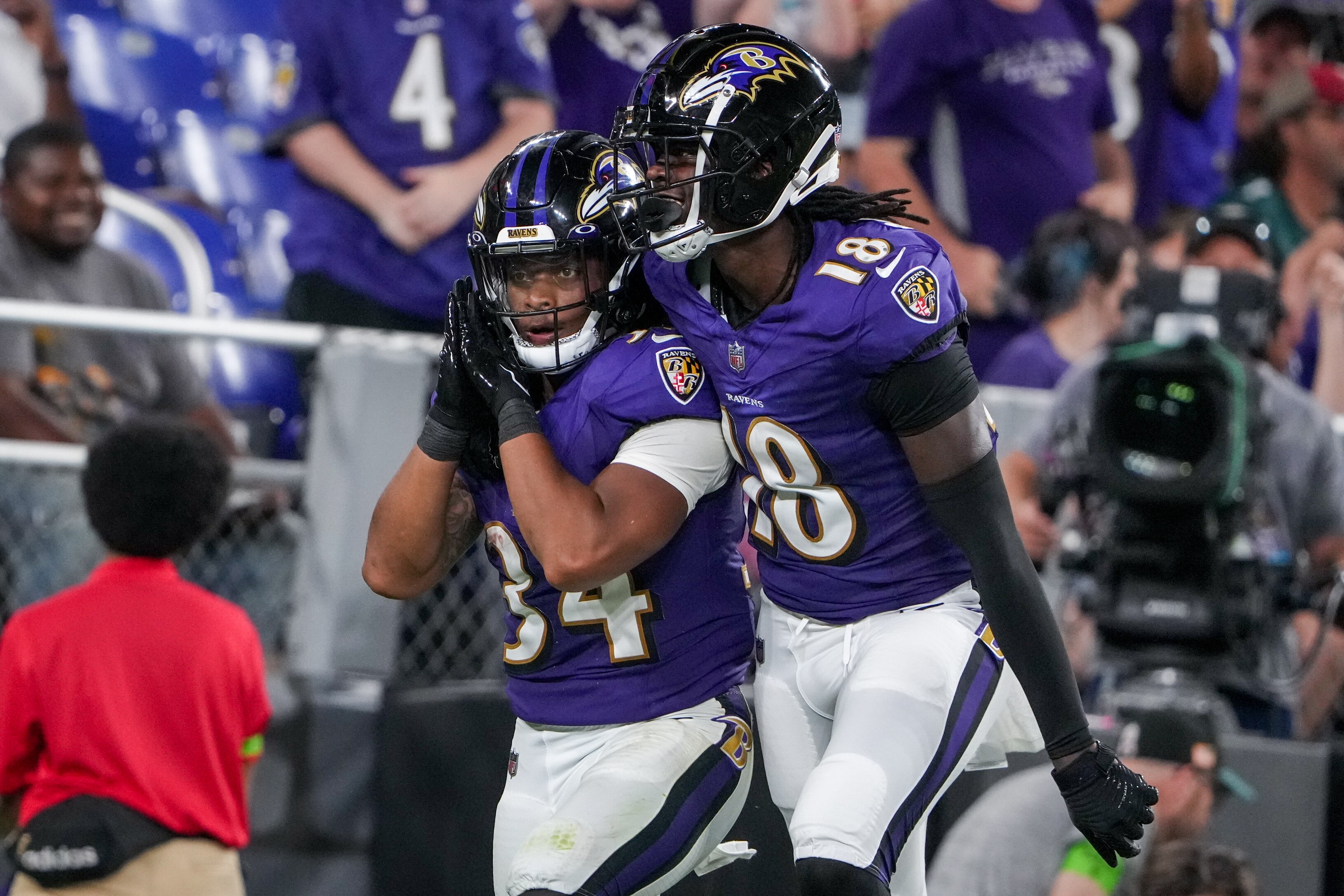 Baltimore Ravens running back Keaton Mitchell (34) celebrates a touchdown rush (that was later called back) with wide receiver Dontay Demus Jr. (18) during a preseason game at M&T Bank Stadium on Saturday, August 12, 2023.