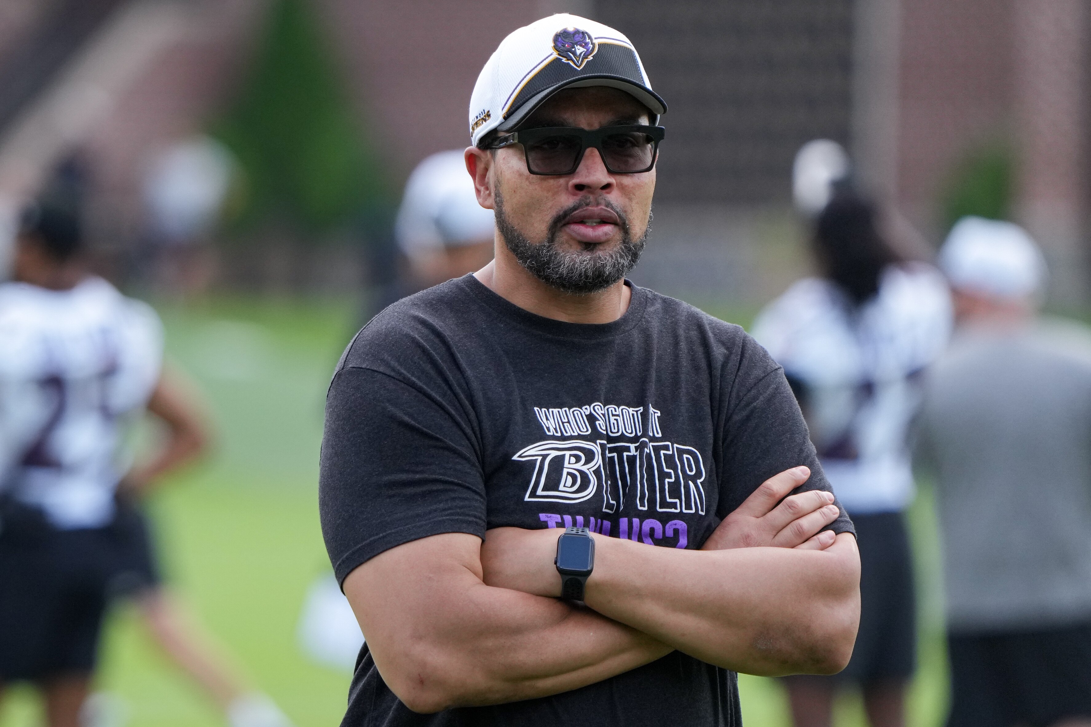 Pass rush coach Chuck Smith observes players during organized team activities on June 4.