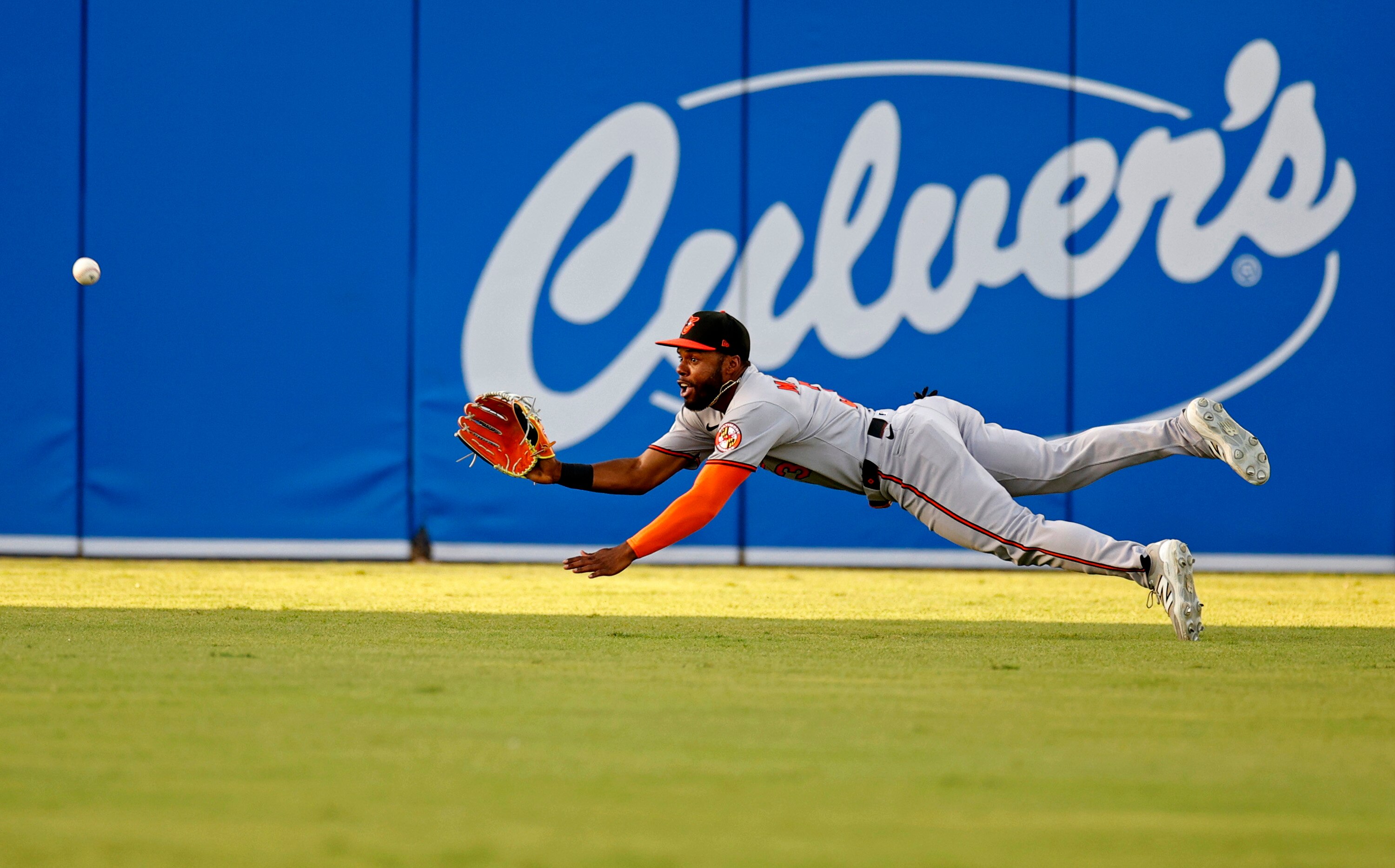 Orioles center fielder Cedric Mullins dives for a ball during the first inning Friday night against the Rays.