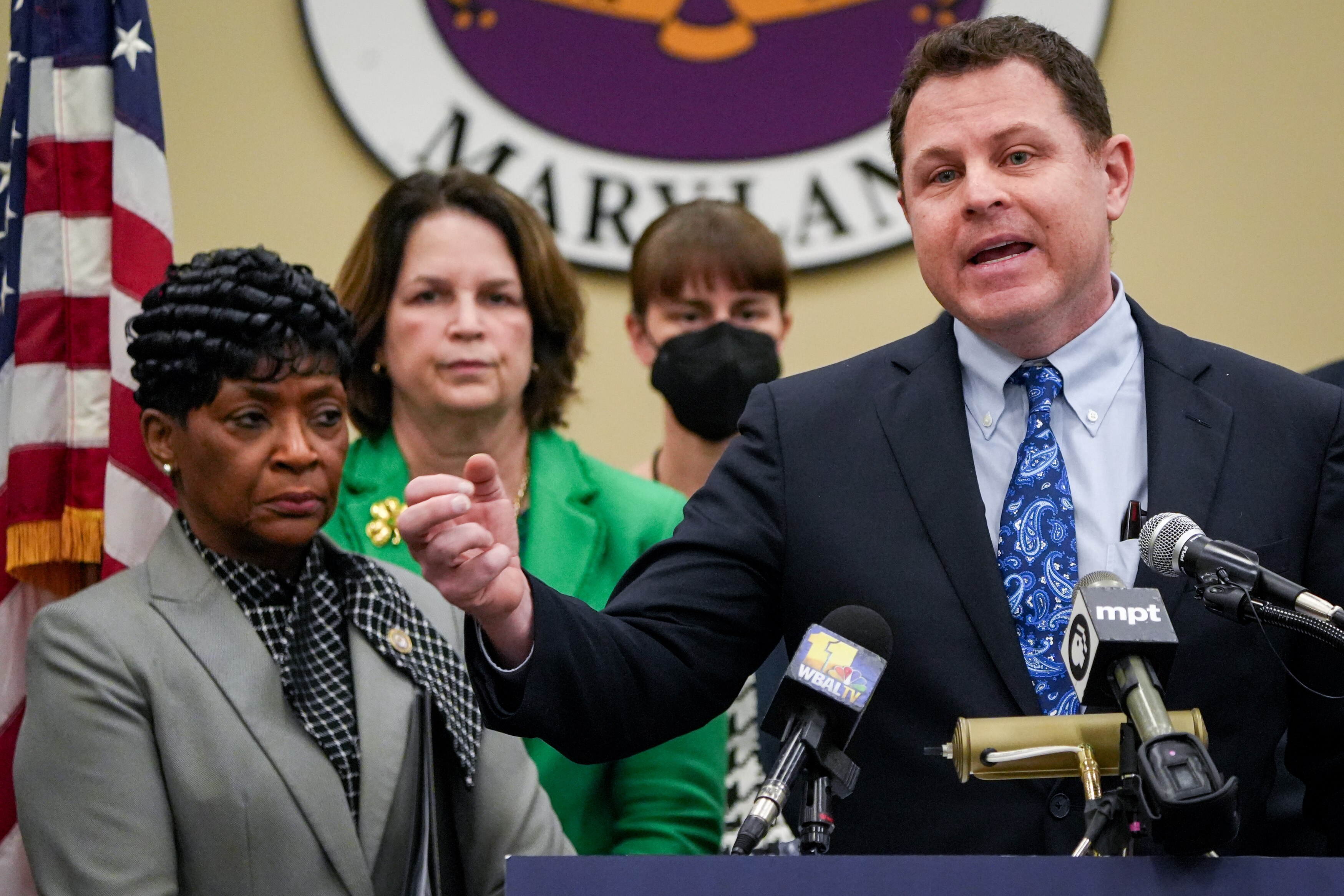 Del. Ben Barnes, chair of the House of Delegates Appropriations Committee, standing with House Speaker Adrienne A. Jones by his side, talks about the importance of raising money for the state’s education and transportation programs.