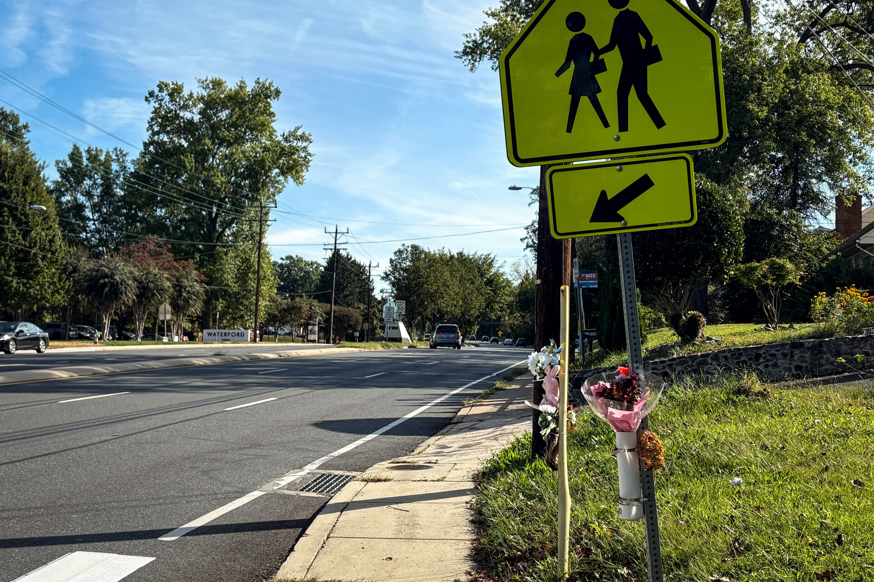 A makeshift memorial of flowers, a teddy bear, a cross and a baseball glove hang on a utility line Friday at University Boulevard West and St. Paul Street. The intersection is where James Evert Anderson, 16, was killed on Sept. 21 in a pedestrian crash.