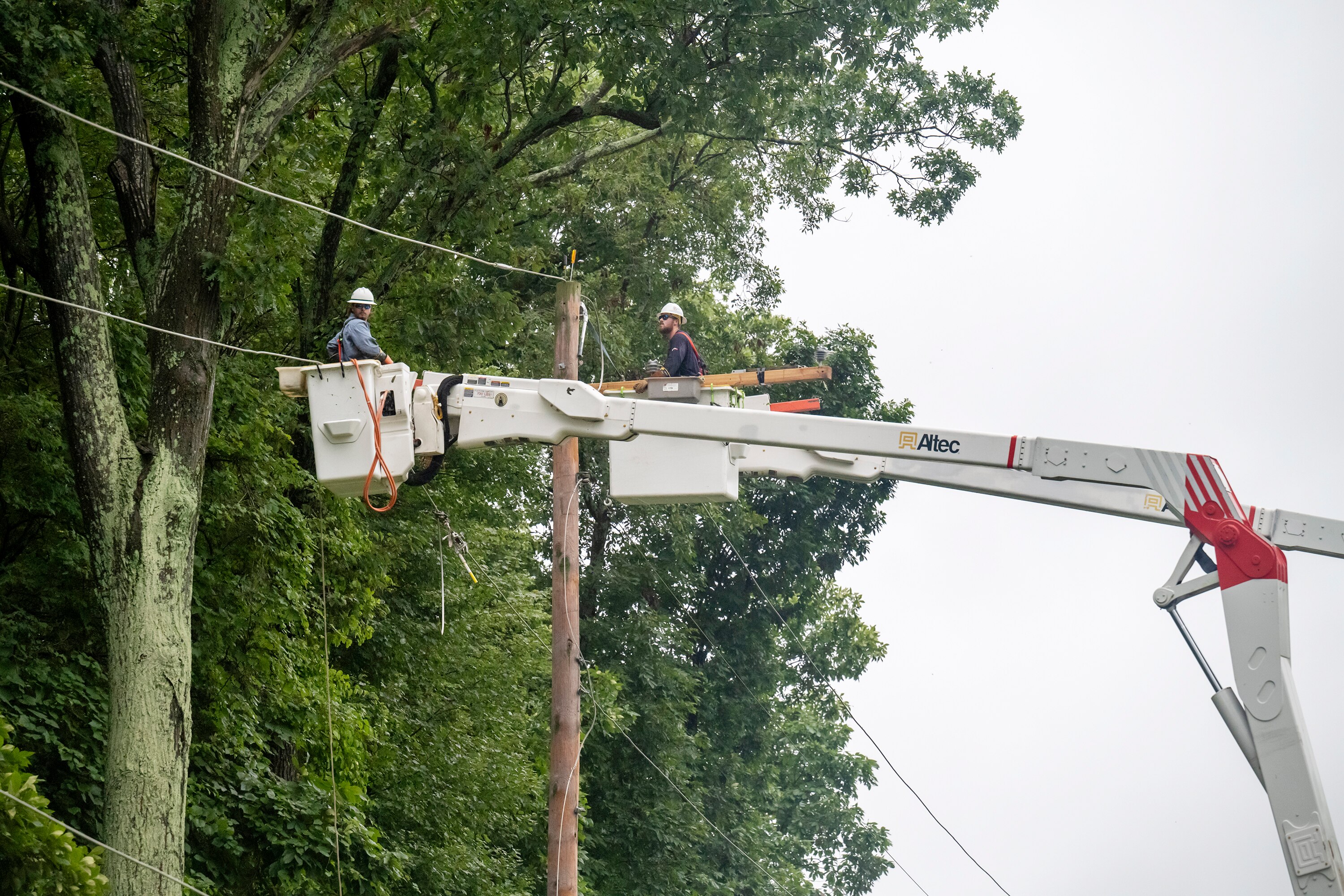 Lineman from Baltimore Gas and Electric repair power lines the morning after the remnants of Hurricane Debby took down power for more than 46,000 customers, Saturday, Aug. 10, 2024.