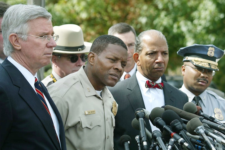 From left, Maryland Governor Paris Glendening, Montgomery County Police Chief Charles Moose, Washington, D.C. Mayor Tony Williams and Prince George's County Police Chief Gerald Wilson speak to the media