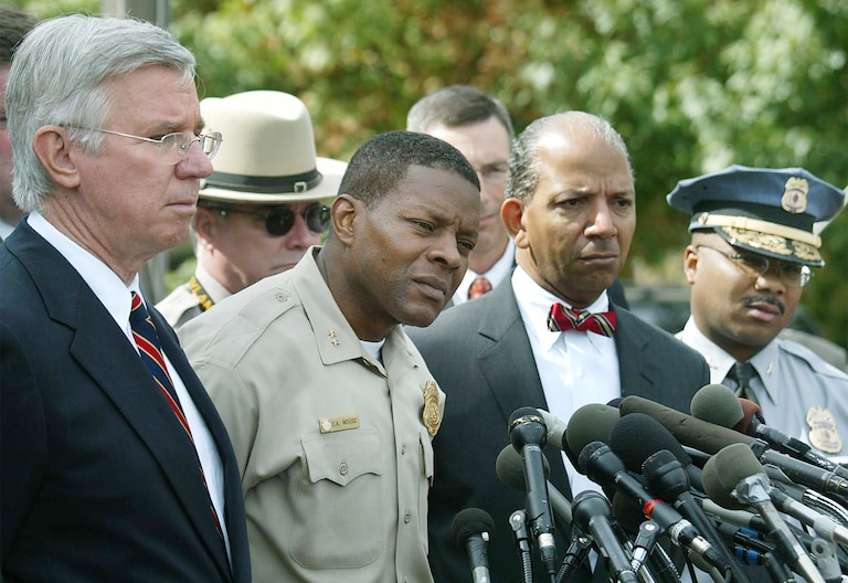 From left, Maryland Governor Paris Glendening, Montgomery County Police Chief Charles Moose, Washington, D.C. Mayor Tony Williams and Prince George's County Police Chief Gerald Wilson speak to the media