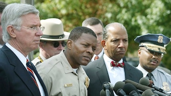 From left, Maryland Governor Paris Glendening, Montgomery County Police Chief Charles Moose, Washington, D.C. Mayor Tony Williams and Prince George's County Police Chief Gerald Wilson speak to the media