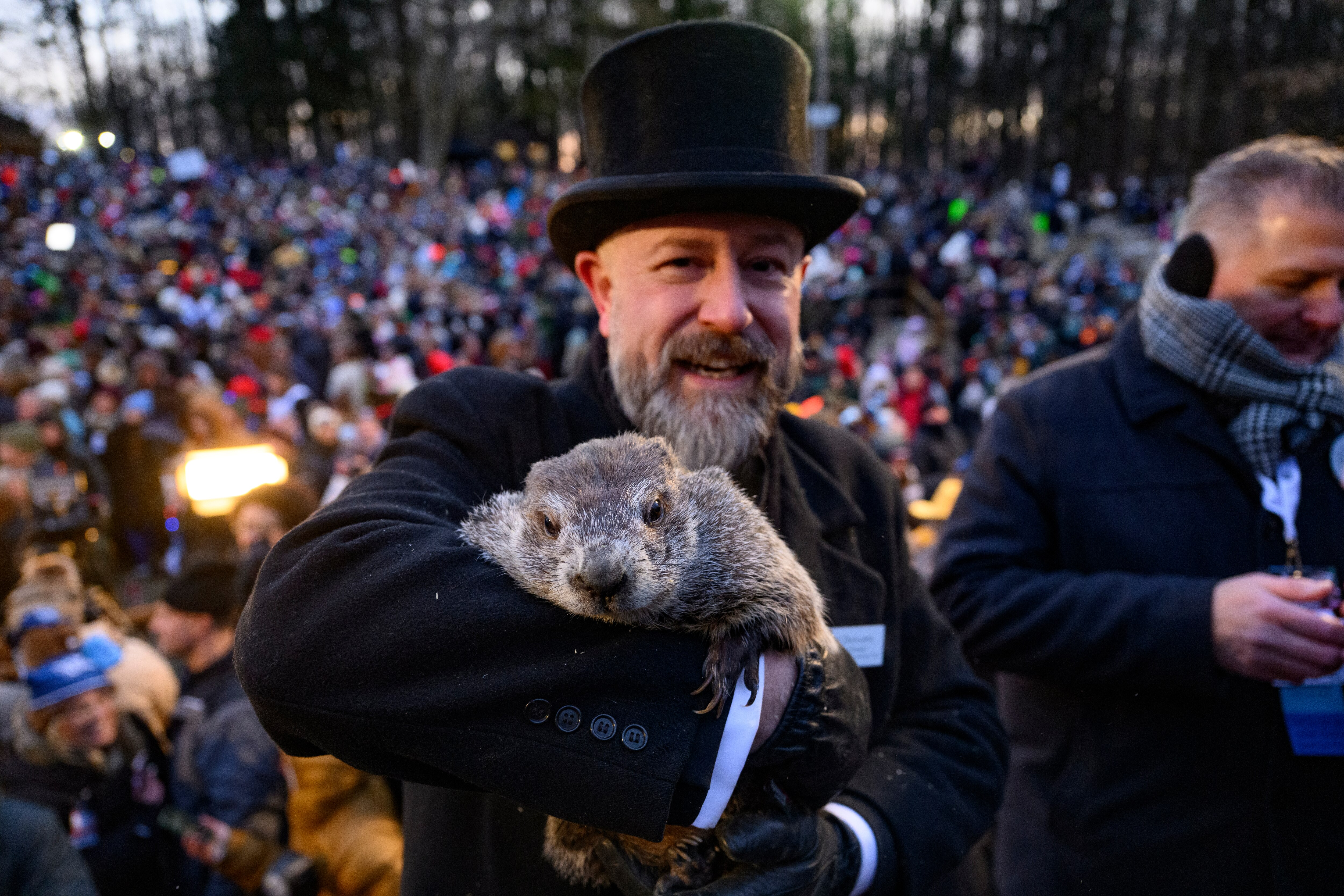 Groundhog handler AJ Dereume holds Punxsutawney Phil after he saw his shadow, predicting 6 more weeks of winter during the 139th annual Groundhog Day festivities on Sunday in Punxsutawney, Pennsylvania.