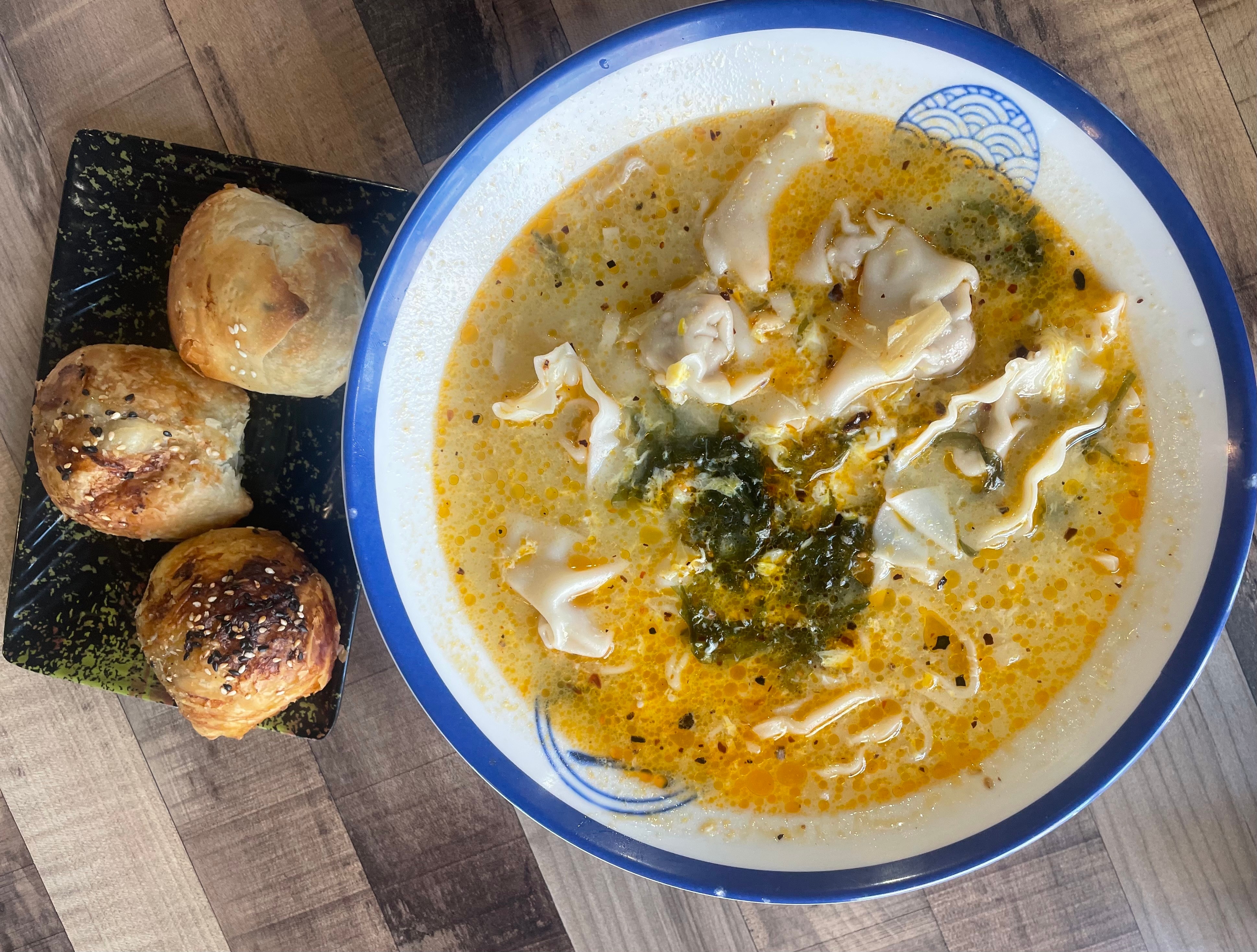 The duck wonton noodle soup and a side of lamb "samosas" at Colala Grind Express in BioPark.