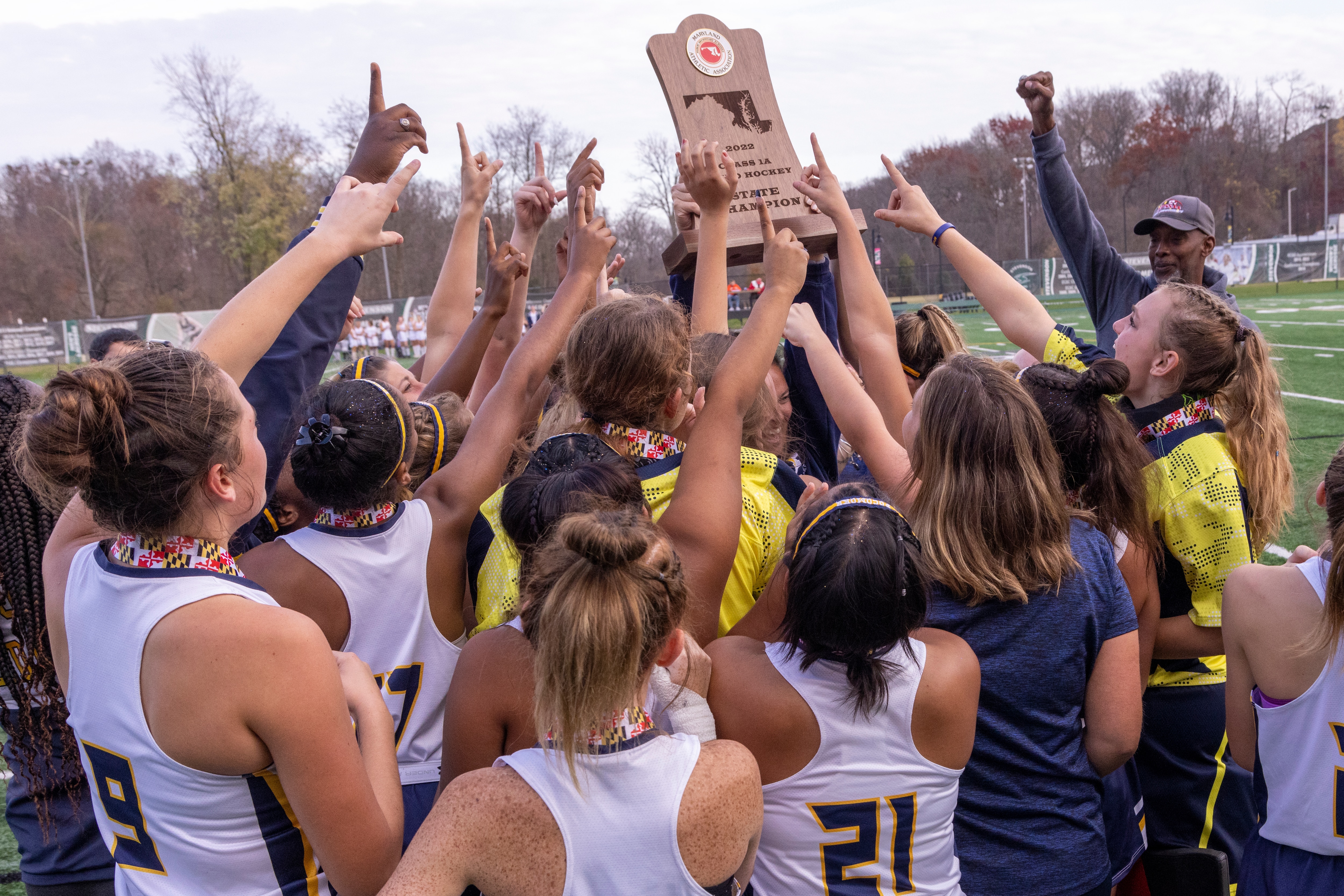 Pocomoke hoists the 1A field hockey state championship trophy after pulling away from South Carroll in the second half for a 5-1 victory in the state title game.