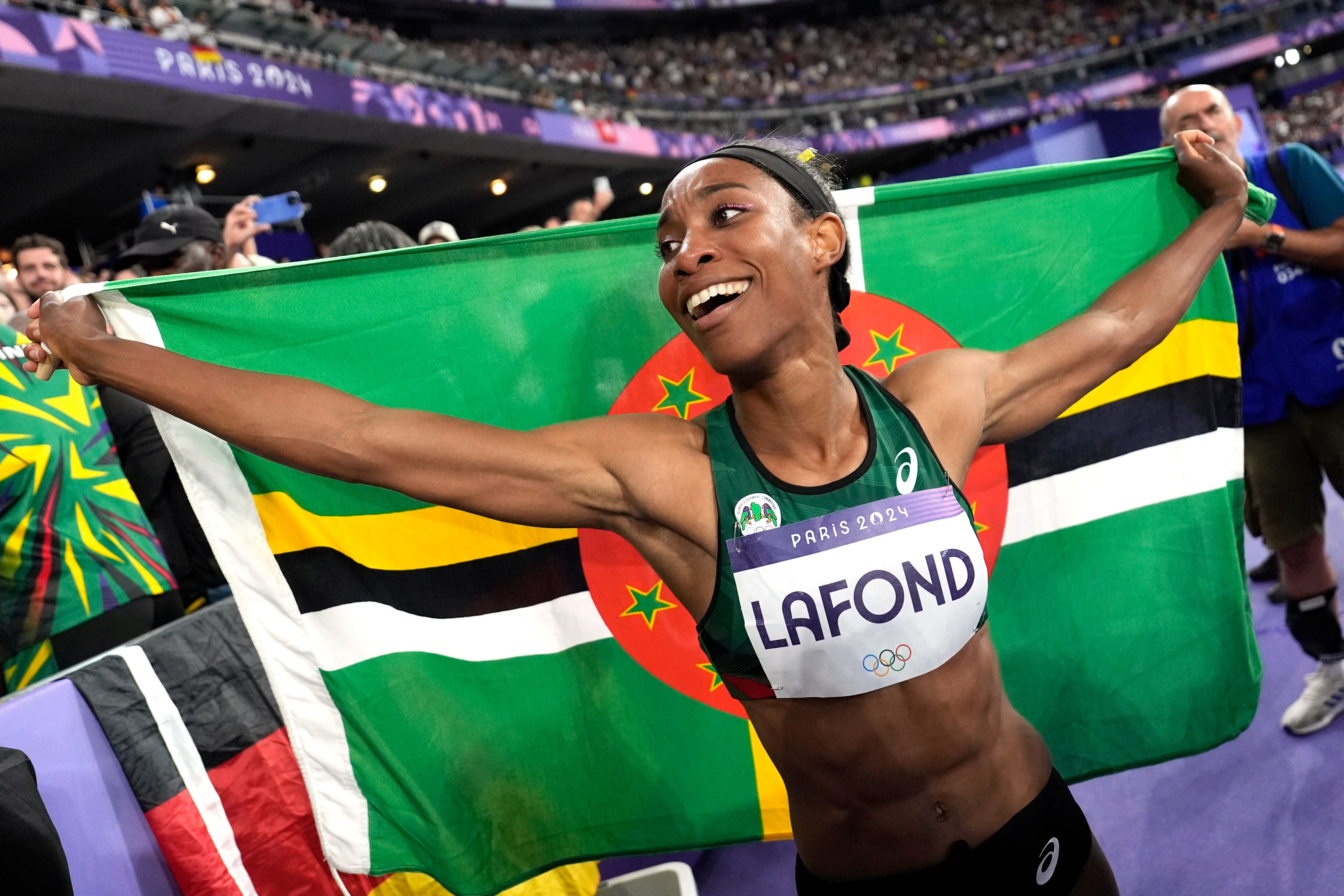 Thea Lafond celebrated after winning the women’s triple jump final at the 2024 Summer Olympics in Saint-Denis, France. 