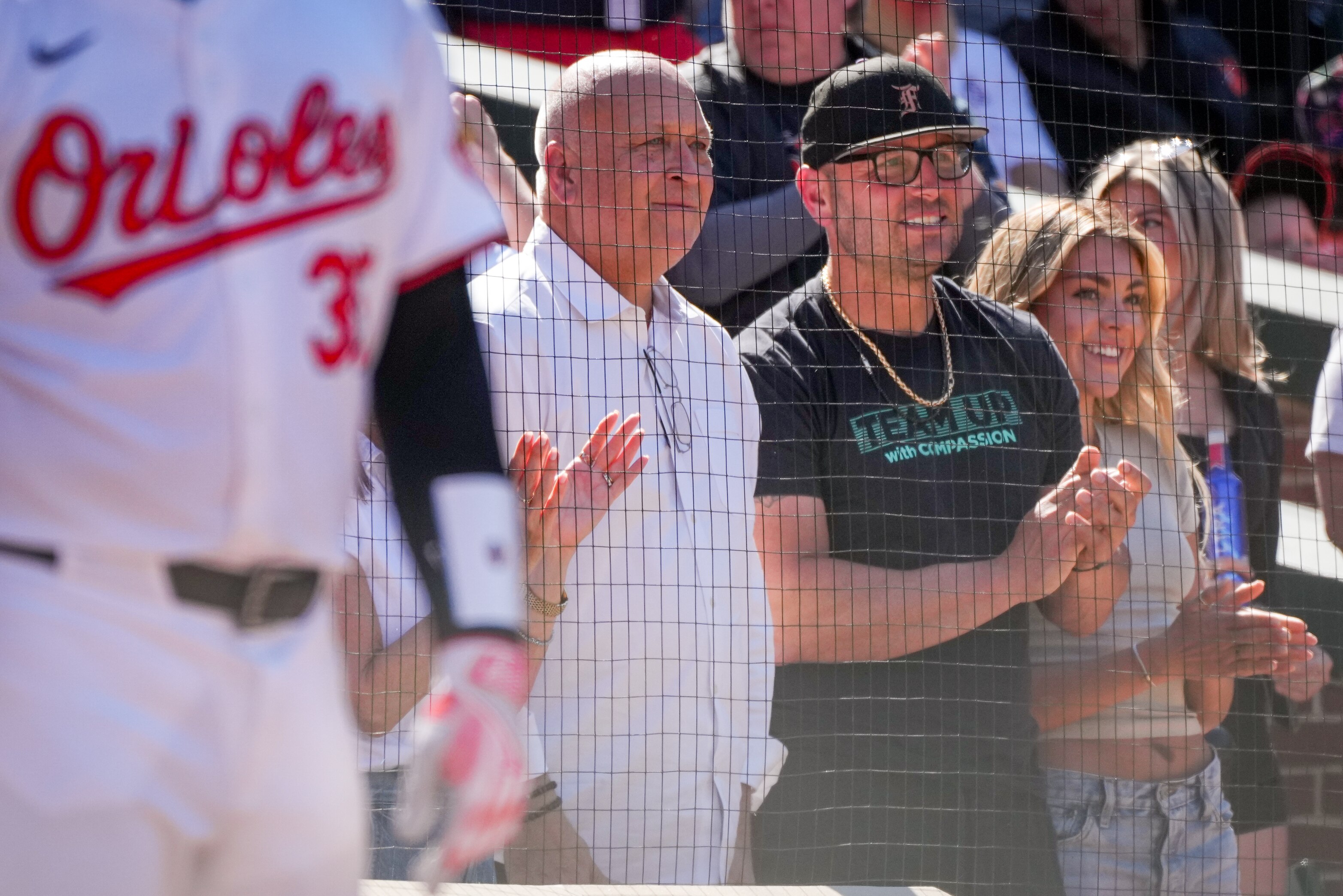 Orioles part owner Cal Ripken Jr. (left) celebrates in the stands with Jackson Holliday’s father, Matt, and wife, Chloe, after Jackson Holliday’s first major league hit.