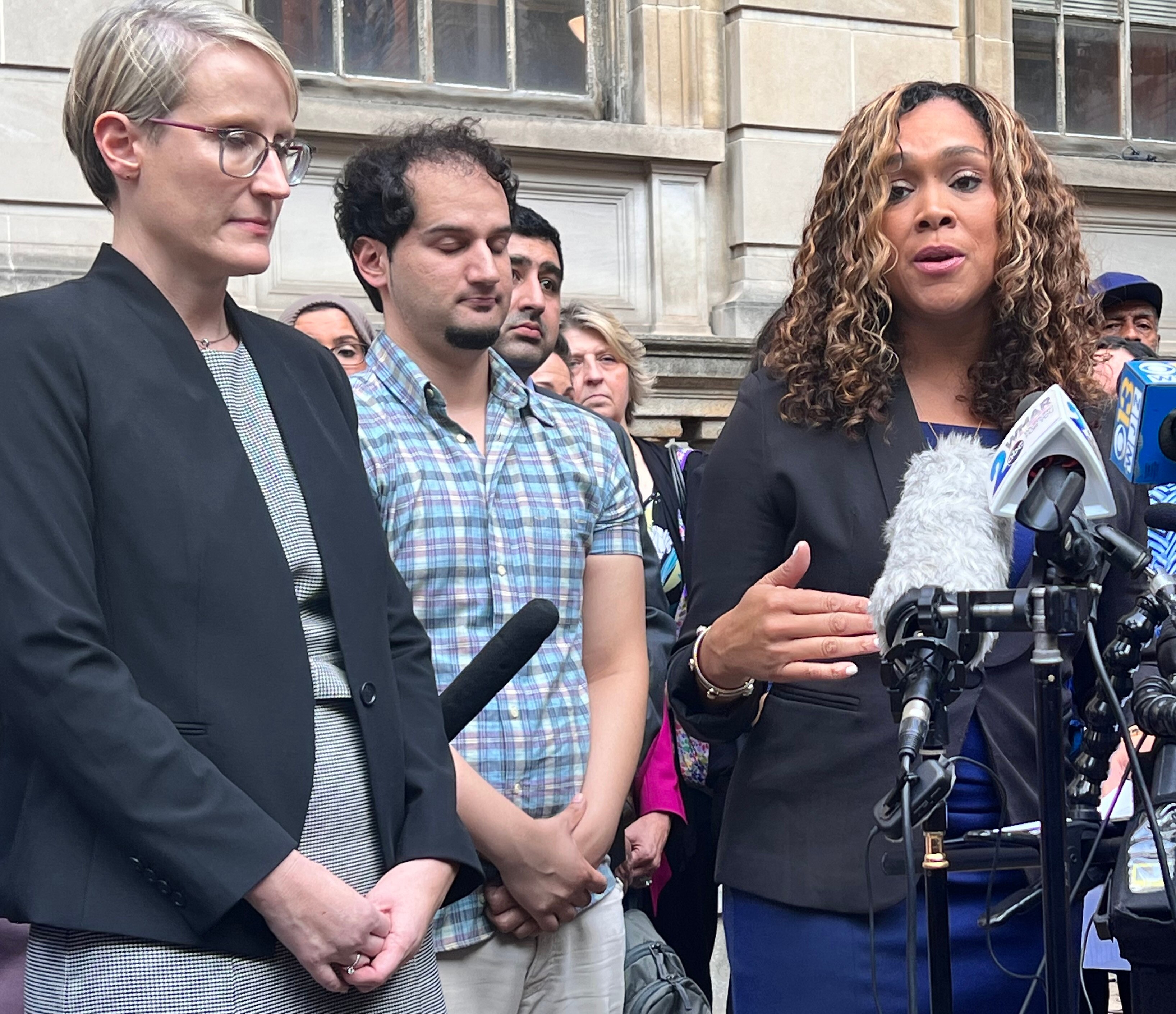 Becky Feldman with Marylin Mosby holds a press conference on the steps of the courthouse after Syed is released.