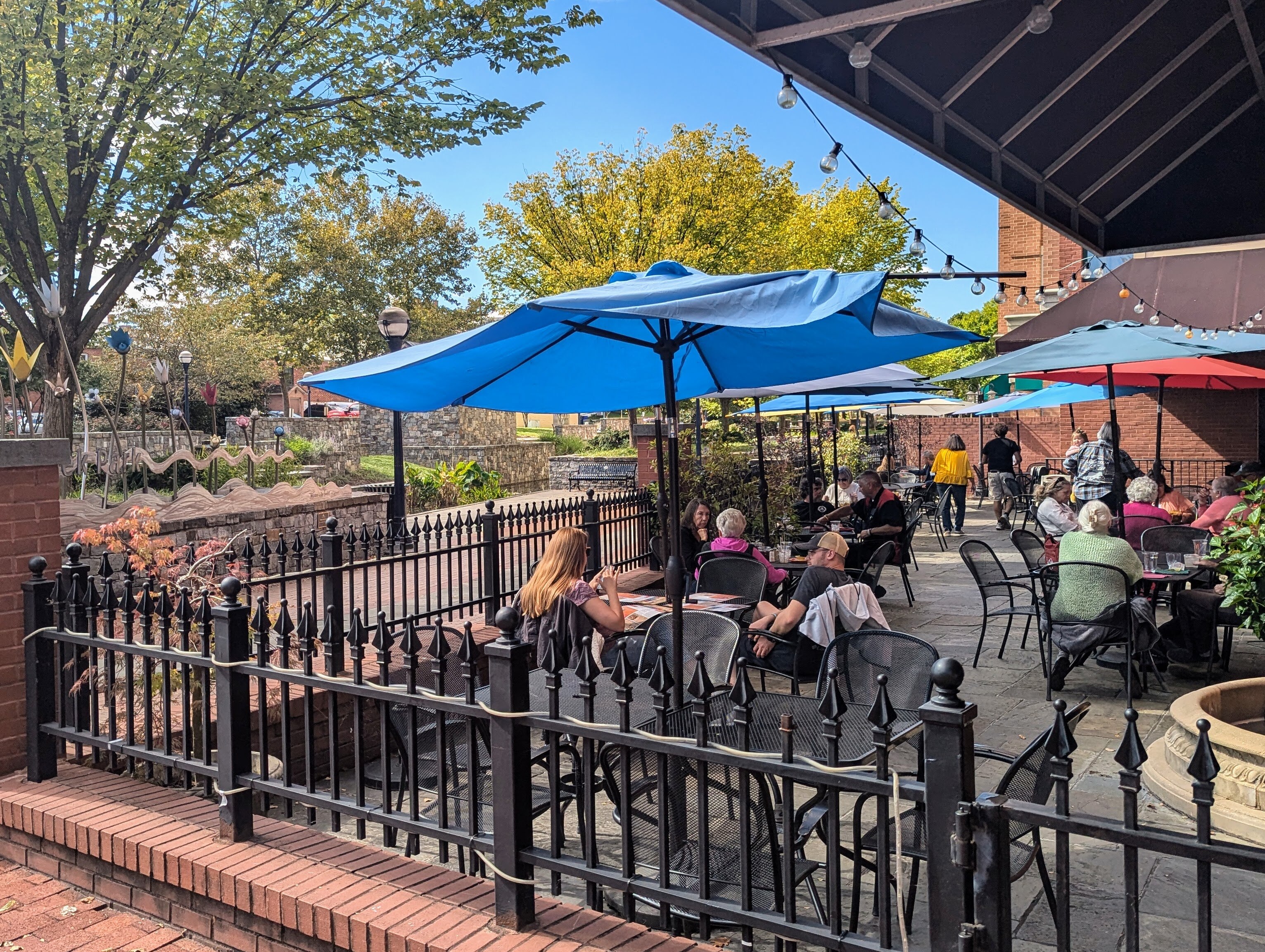 Lunchtime diners enjoy a fall day on Carrol Creek in downtown Frederick on Oct. 8, 2024.