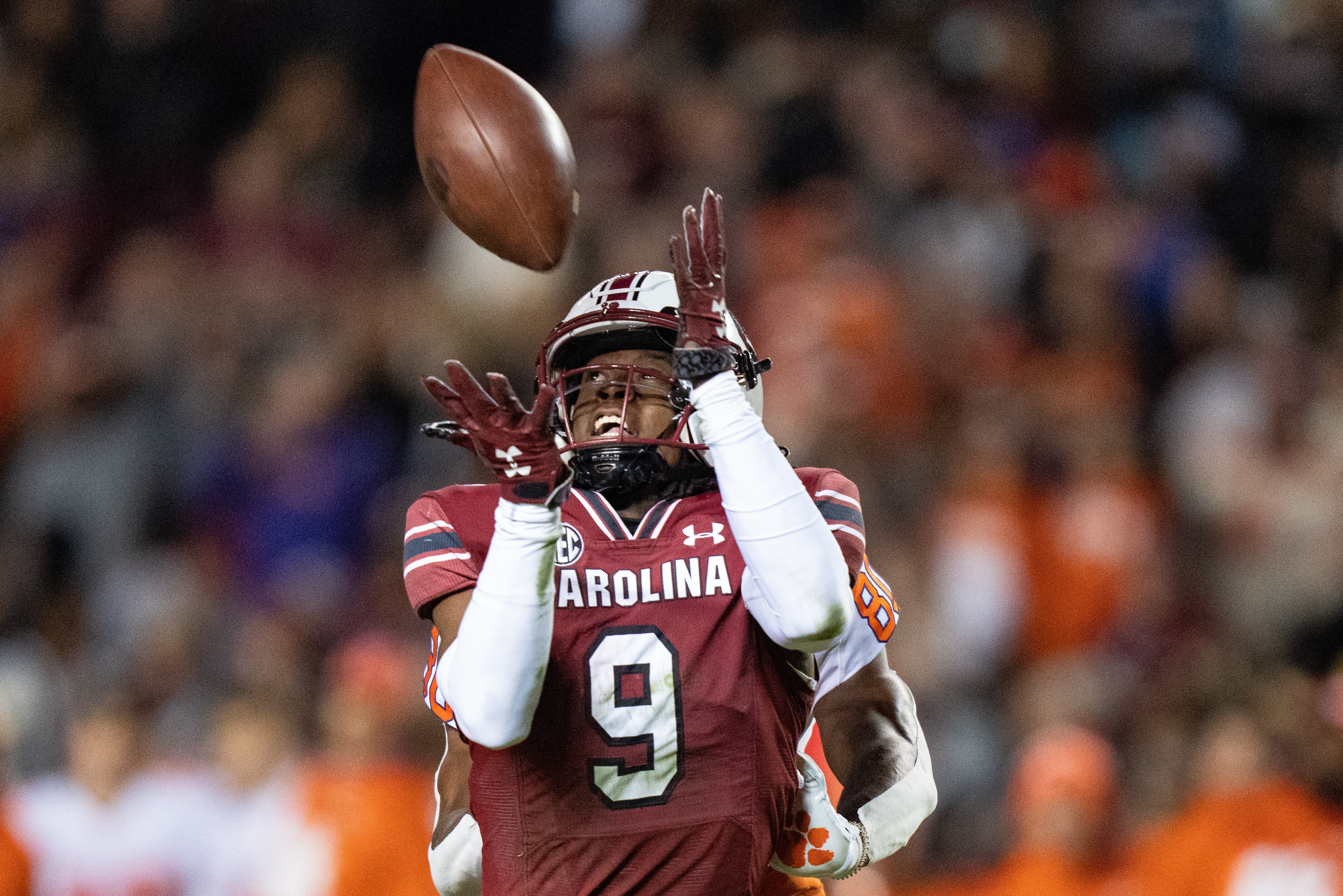 Defensive back Cam Smith #9 of the South Carolina Gamecocks makes an interception against the Clemson Tigers in the first quarter during their game at Williams-Brice Stadium on November 27, 2021 in Columbia, South Carolina.