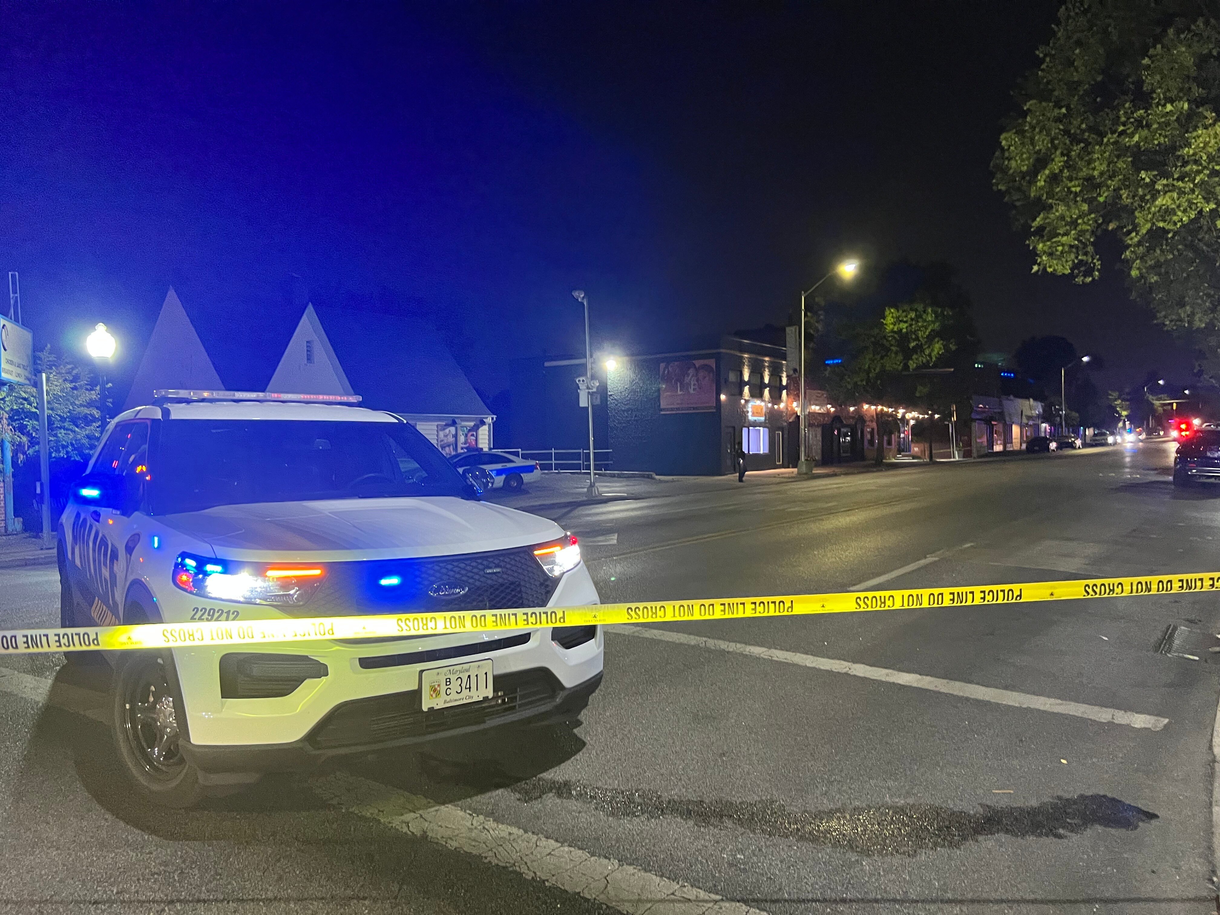 Police respond to the scene of a shooting near the intersection of York Road and East Cold Spring Lane on June 16, 2023.