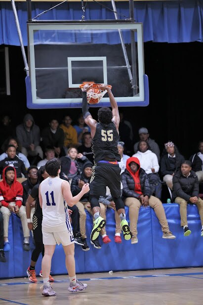 Mount St. Joseph's Imani Hansberry slams home two of his 19 points Wednesday eve ning against Mount Carmel. The Gaels improved to 6-0 with a 72-63 victory in Essex.