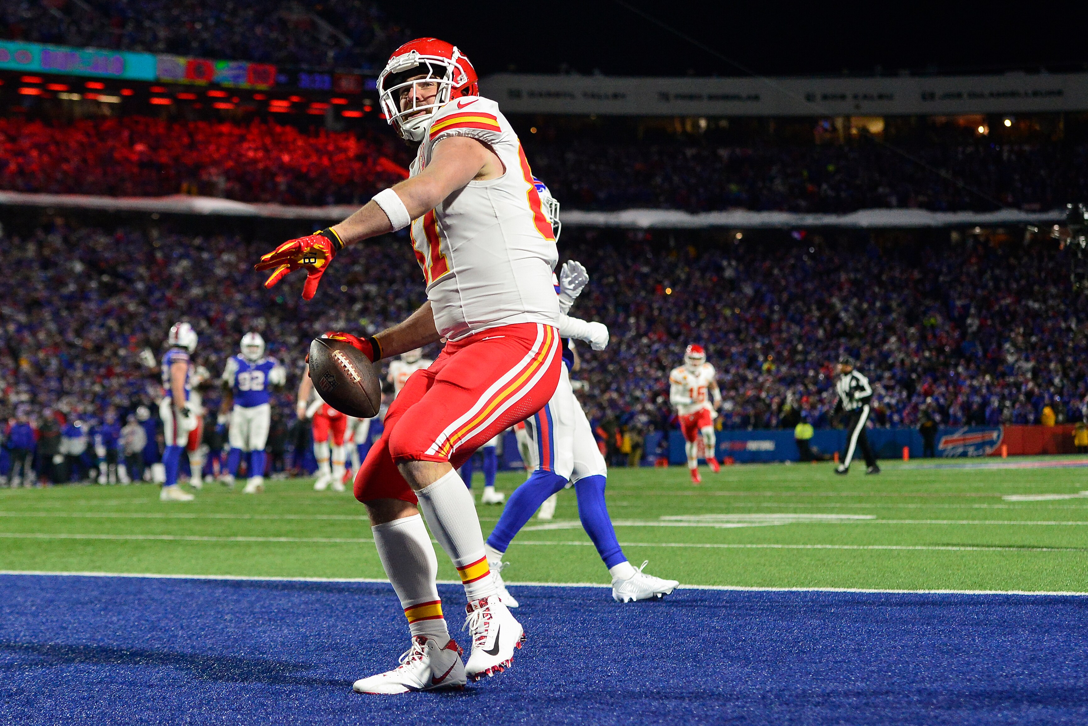 Chiefs tight end Travis Kelce scores one of his two touchdowns in Kansas City's 27-24 win at Buffalo on Sunday.
