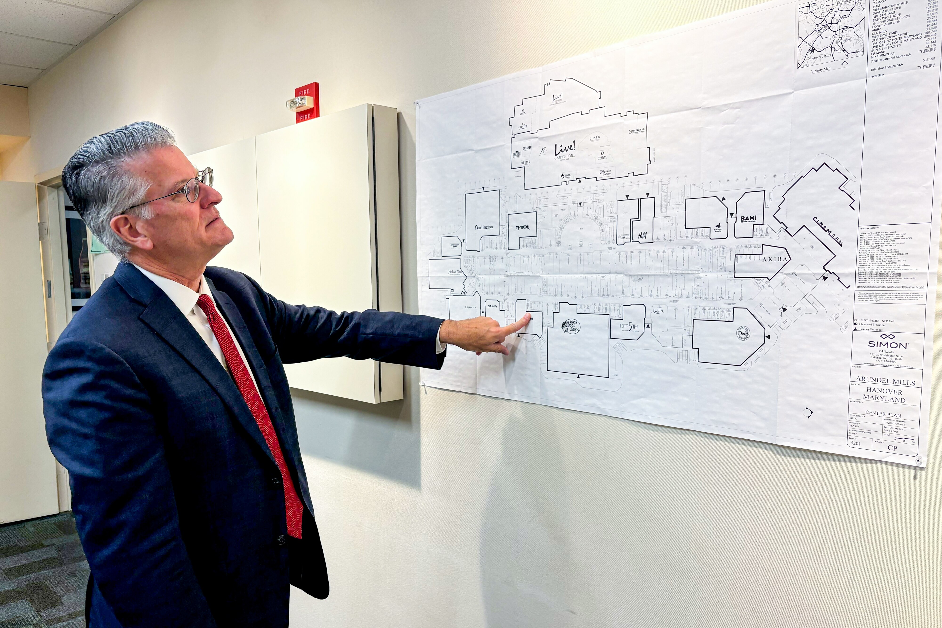 Gene Condon, general manager of Arundel Mills mall, points to a map of the shopping center, showing where a Wayfair outlet will go in early 2026.