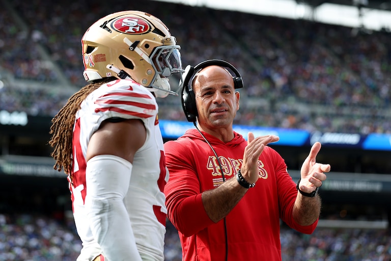 SEATTLE, WASHINGTON - SEPTEMBER 07: Defensive coordinator Robert Saleh of the San Francisco 49ers talks with Fred Warner #54 of the San Francisco 49ers during the game Seahawks at Lumen Field on September 07, 2025 in Seattle, Washington.