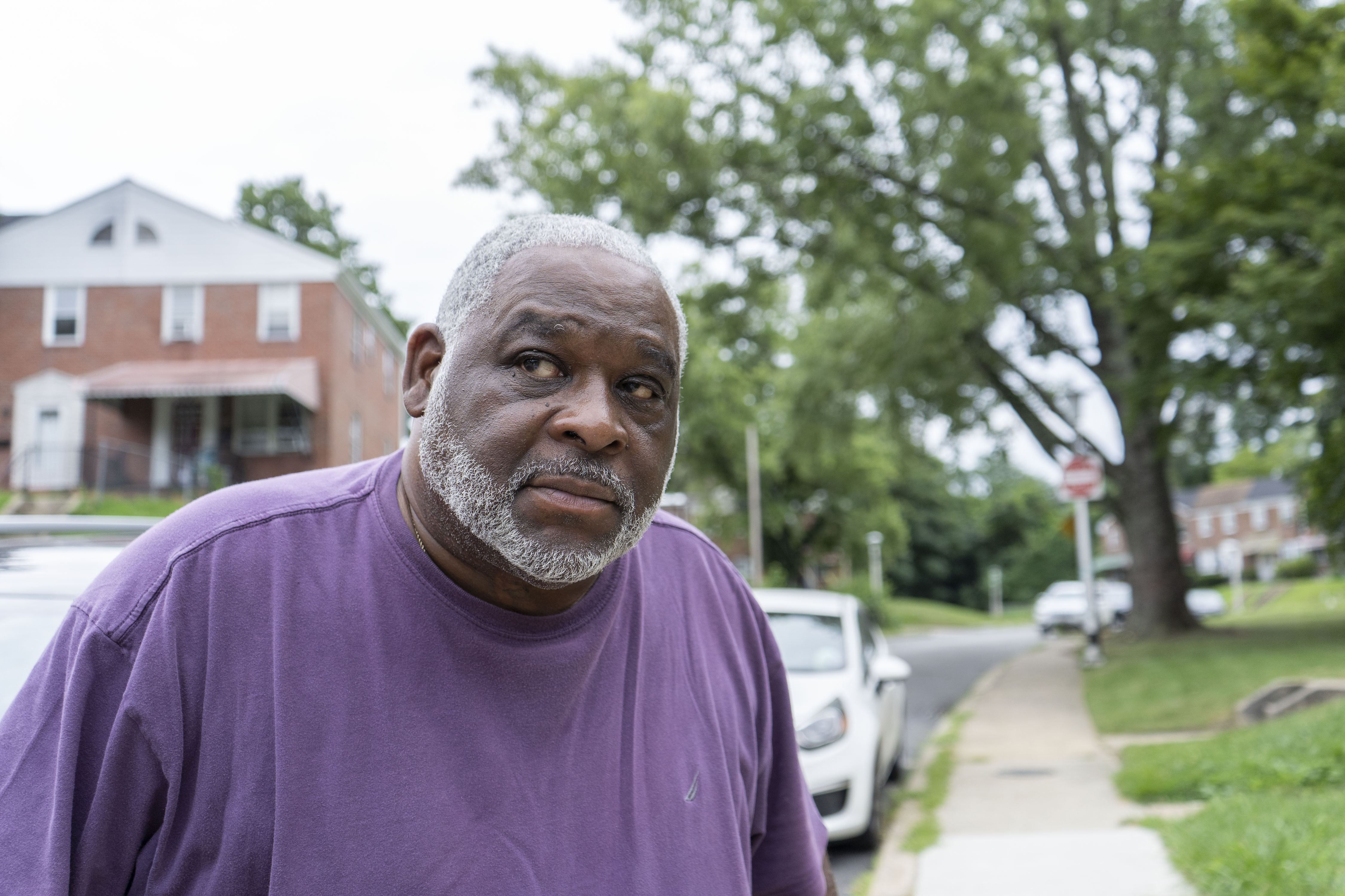 David Smallwood outside of his home in Uplands on July 26. Smallwood has been leading the effort to get the city to clean up the overgrown alleys.