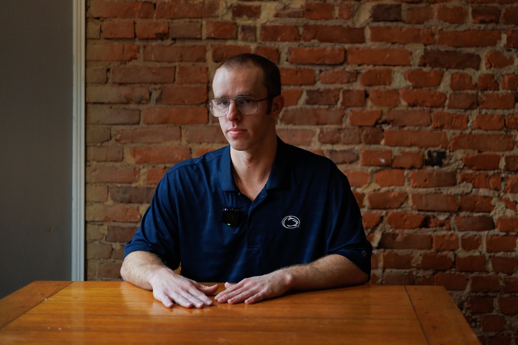 Nate Golden, a math teacher at Forest Park High School, poses for a photo at his home.