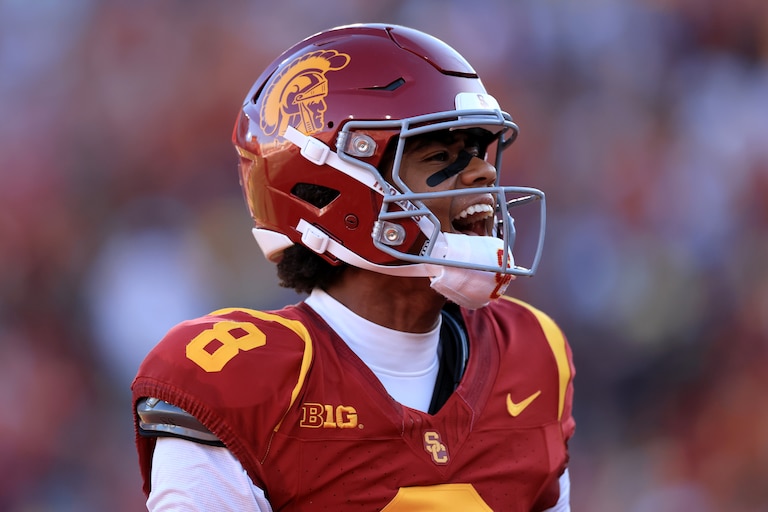 Ja'Kobi Lane #8 of the USC Trojans reacts after catching a touchdown pass against the Michigan Wolverines during the first quarter at Los Angeles Memorial Coliseum on October 11, 2025 in Los Angeles, California.