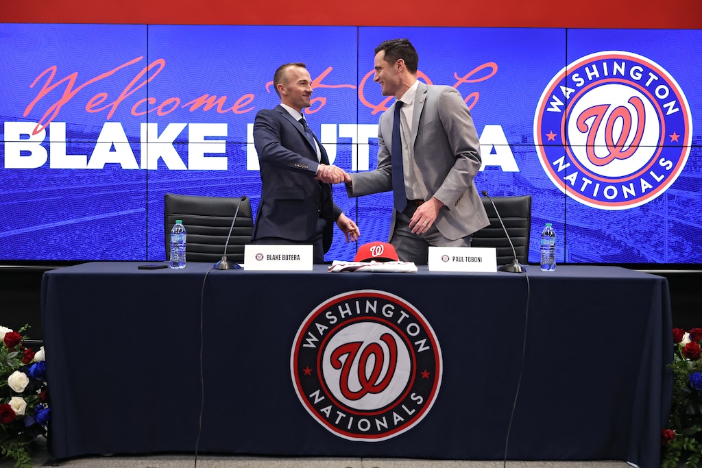 Washington Nationals President of Baseball Operations Paul Toboni, right, shakes hands as introduces Washington Nationals Manager Blake Butera during a press conference at Nationals Park on November 17, 2025 in Washington, D.C.
