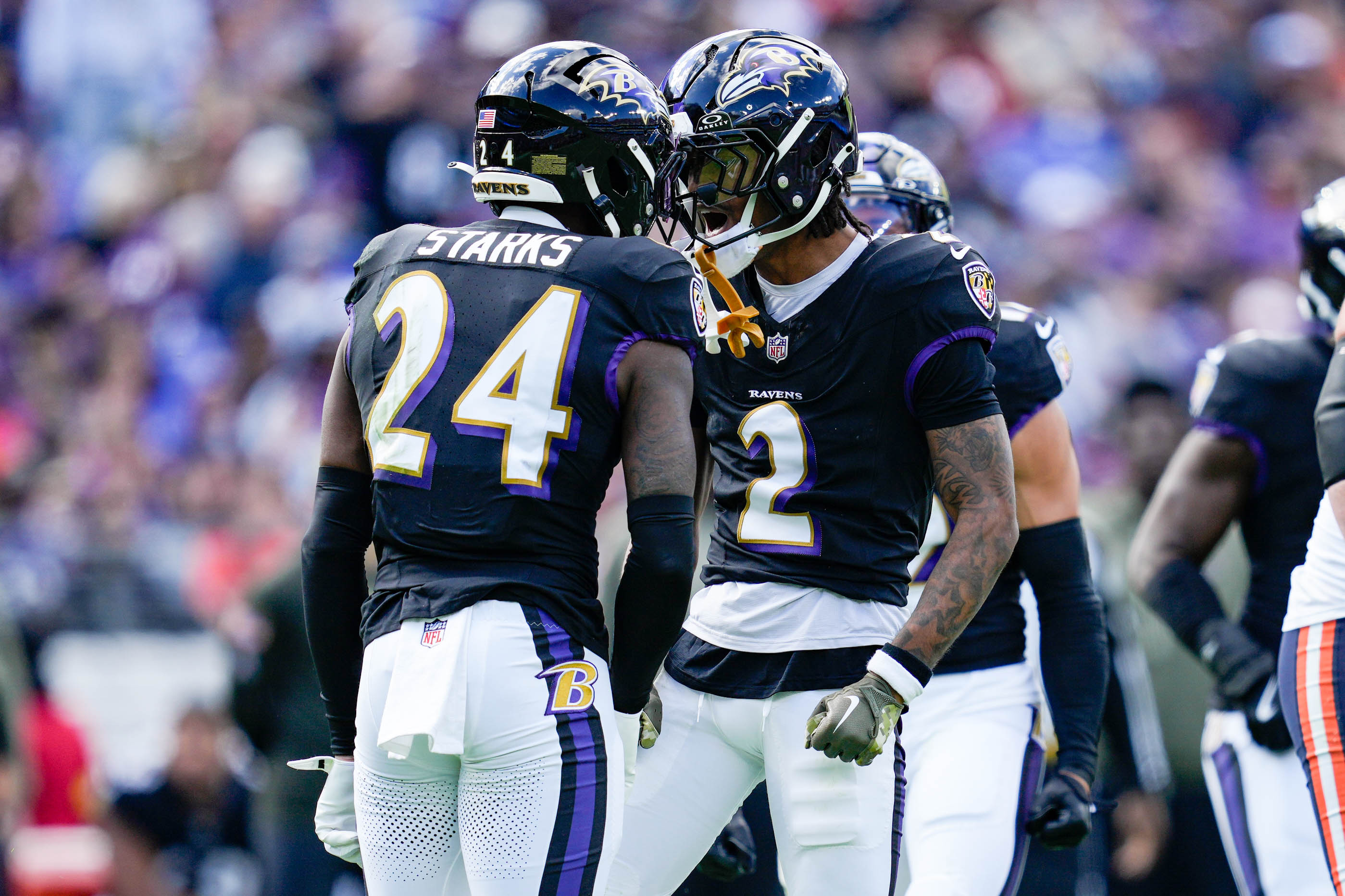 Baltimore Ravens cornerback Nate Wiggins celebrates with safety Malaki Starks after tackling Chicago Bears wide receiver Luther Burden III in the fourth quarter of Sunday’s game.