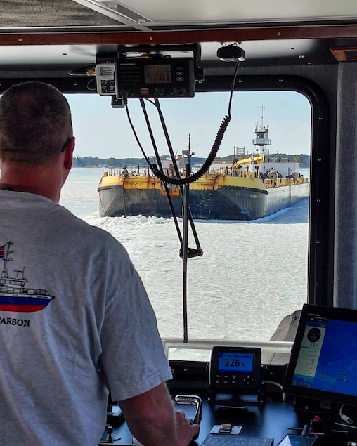 Shawn Ridgley, captain of DNR’s Eddie Somers icebreaker, approaches a frozen barge on the Wicomico.