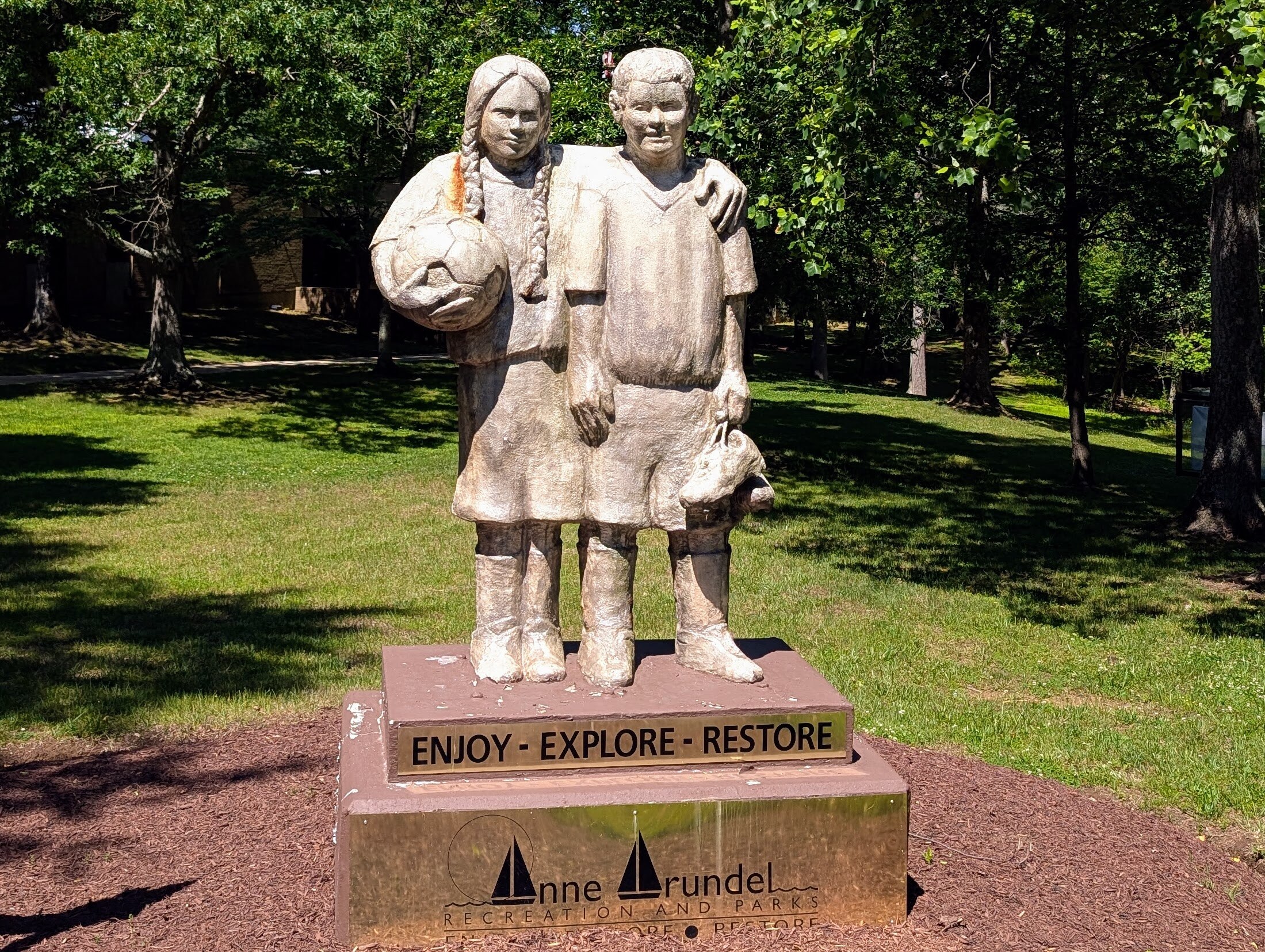 The statue of two young soccer players stands at the entrance to the Anne Arundel County Recreation and Parks offices near Annapolis.