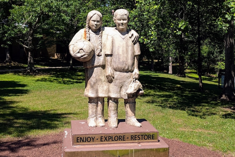 The statue of two young soccer players stands at the entrance to the Anne Arundel County Recreation and Parks offices near Annapolis.