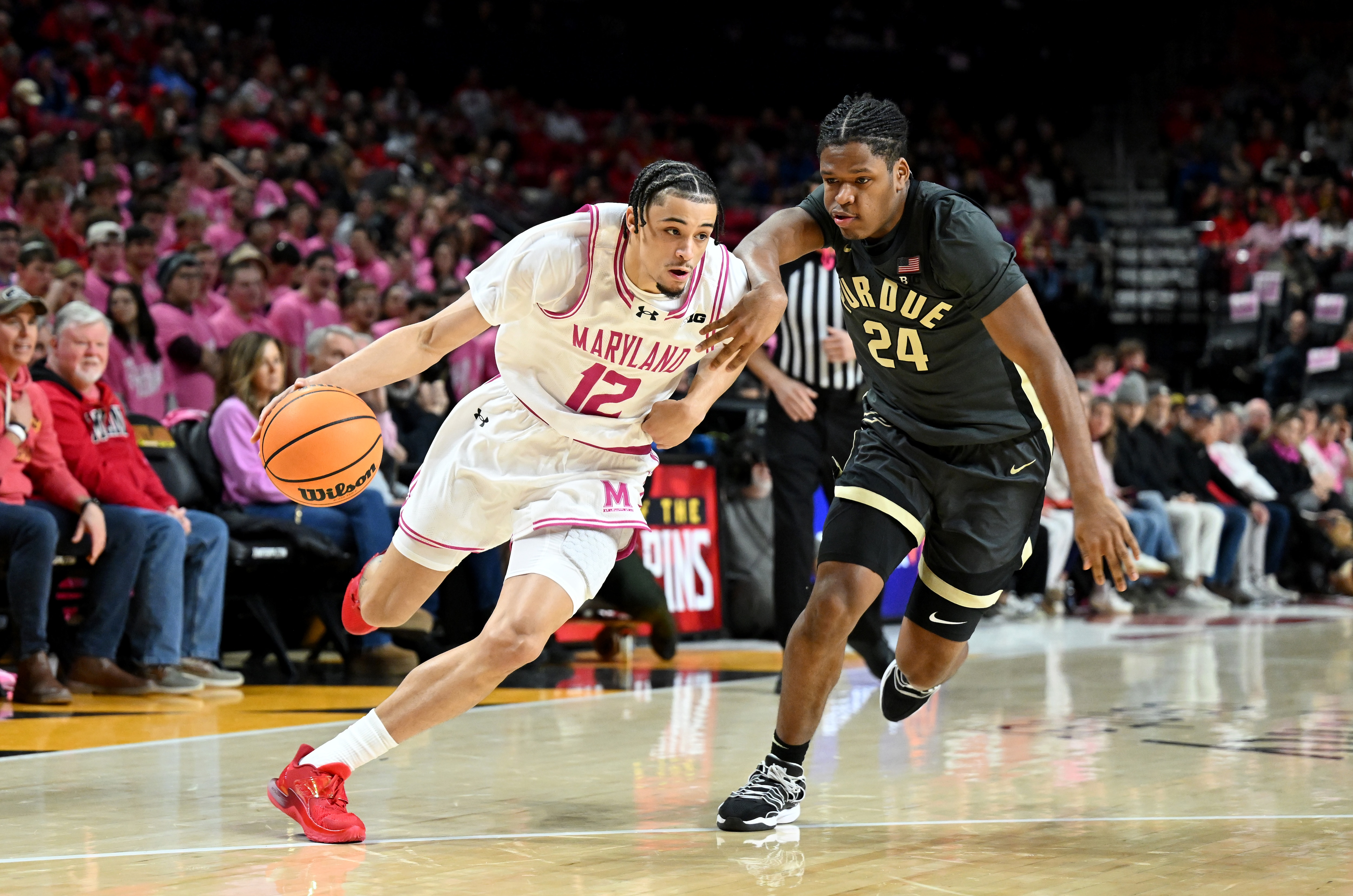 Isaiah Watts of Maryland drives against Gicarri Harris of Purdue on Sunday during the Boilermakers’ 93-63 win.
