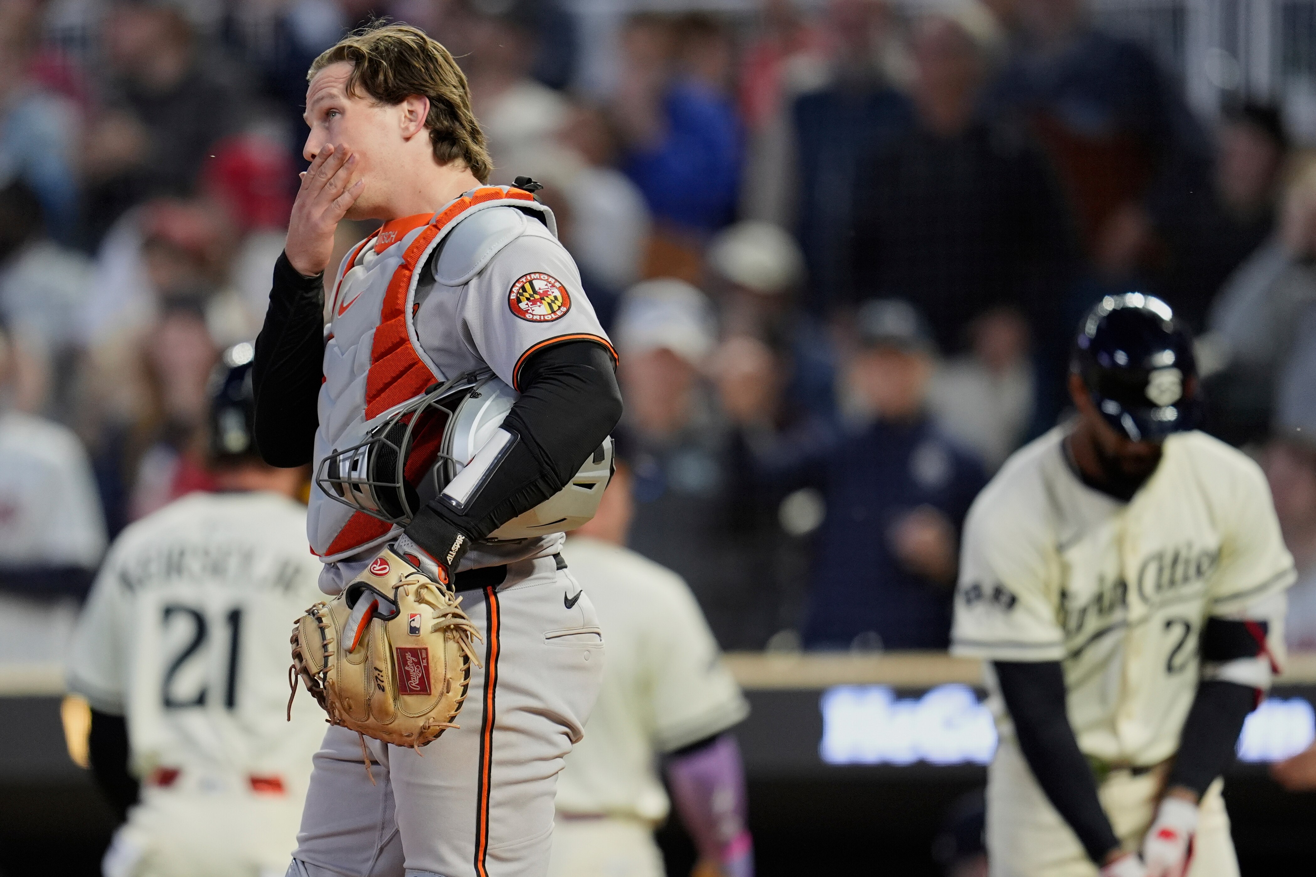Baltimore Orioles catcher Adley Rutschman (35) stands by home plate after a 2-run home run by Minnesota Twins' Harrison Bader (12) during the seventh inning of a baseball game Wednesday, May 7, 2025, in Minneapolis. (AP Photo/Abbie Parr)