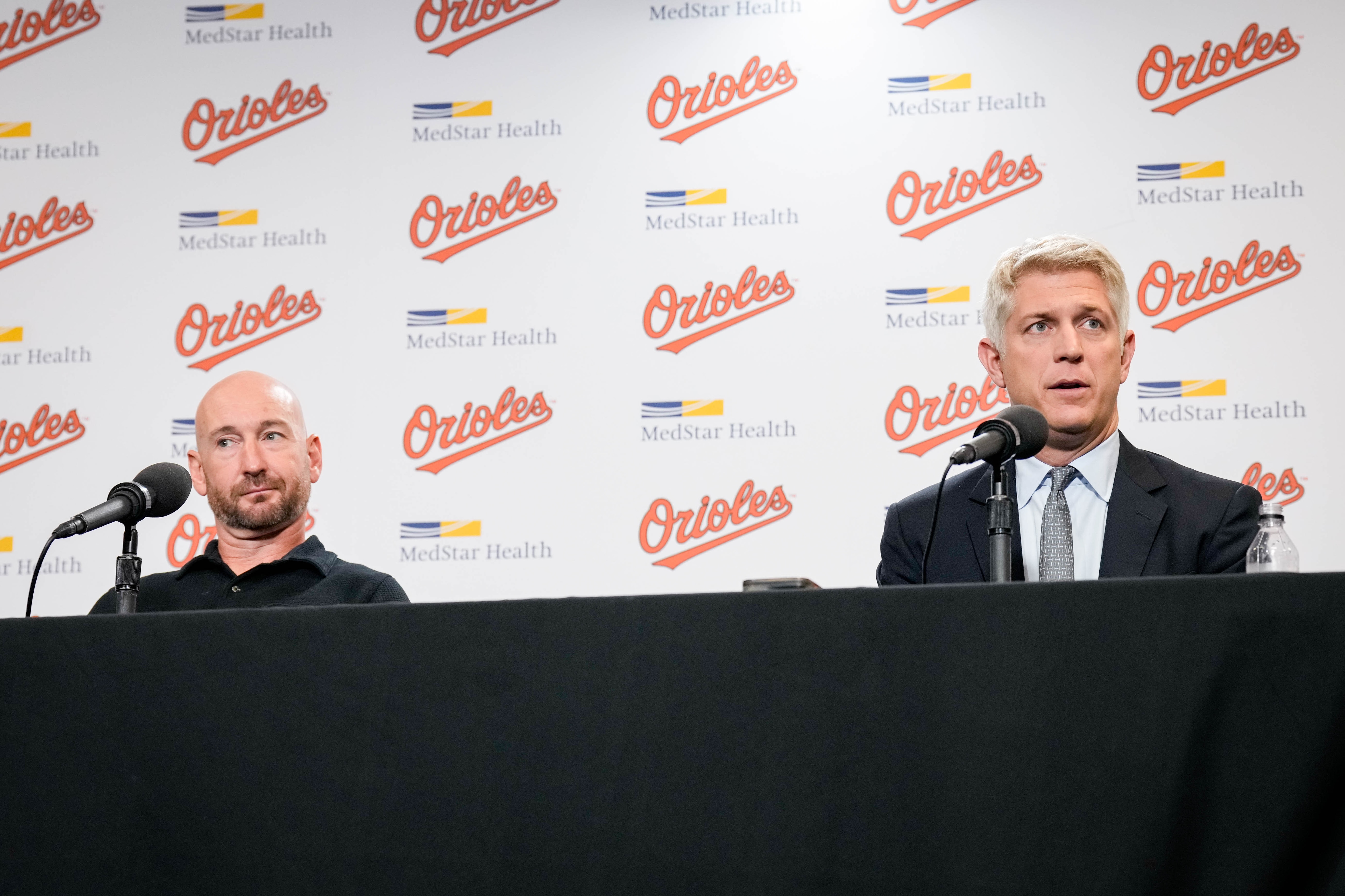 Orioles manager Craig Albernaz, left, and president of baseball operations Mike Elias, right, take questions from reporters during the team’s end-of-season news conference on Monday.