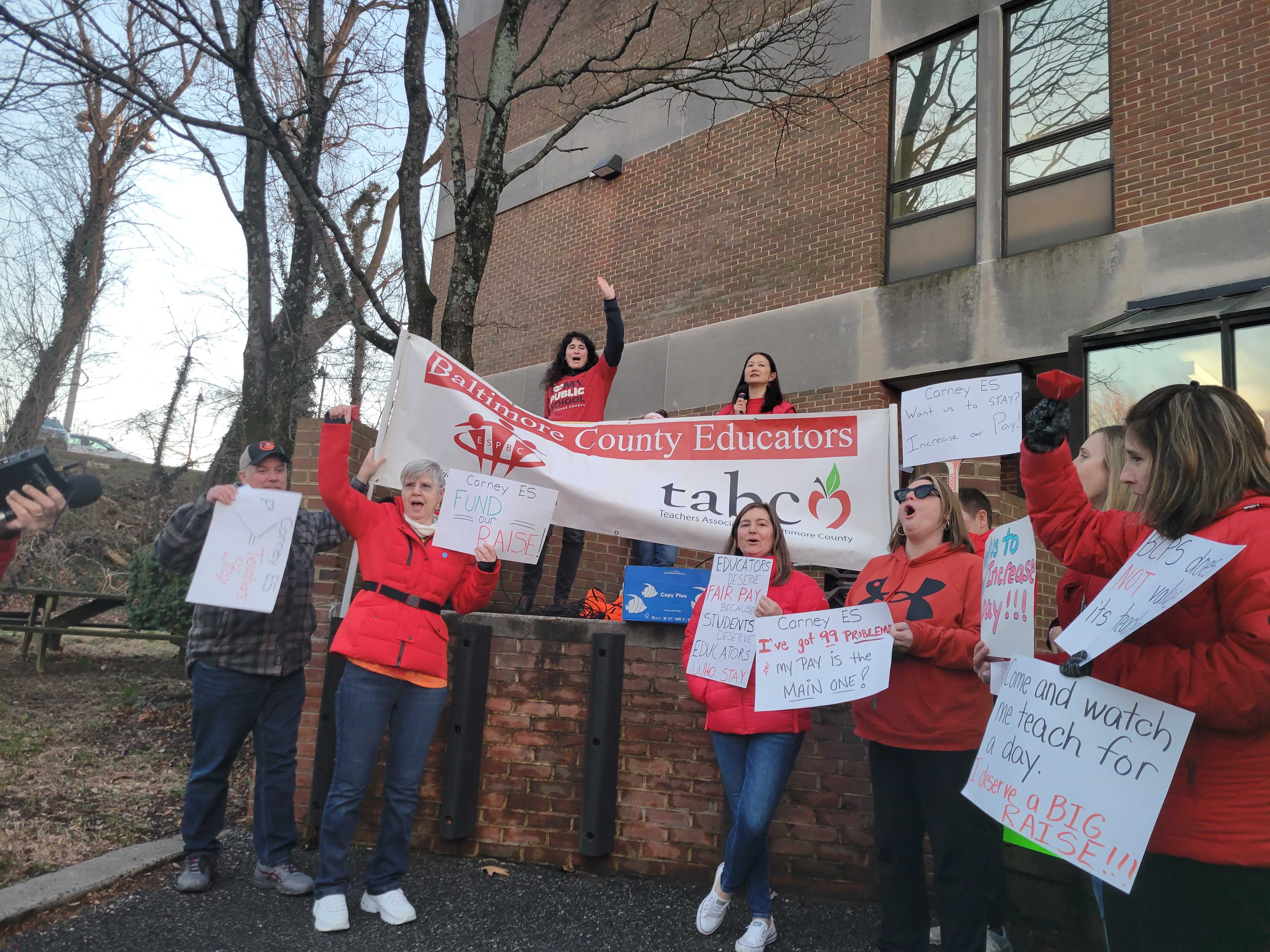 Educators of Baltimore County Public Schools rally for better pay outside the Baltimore County board of education building in Towson.