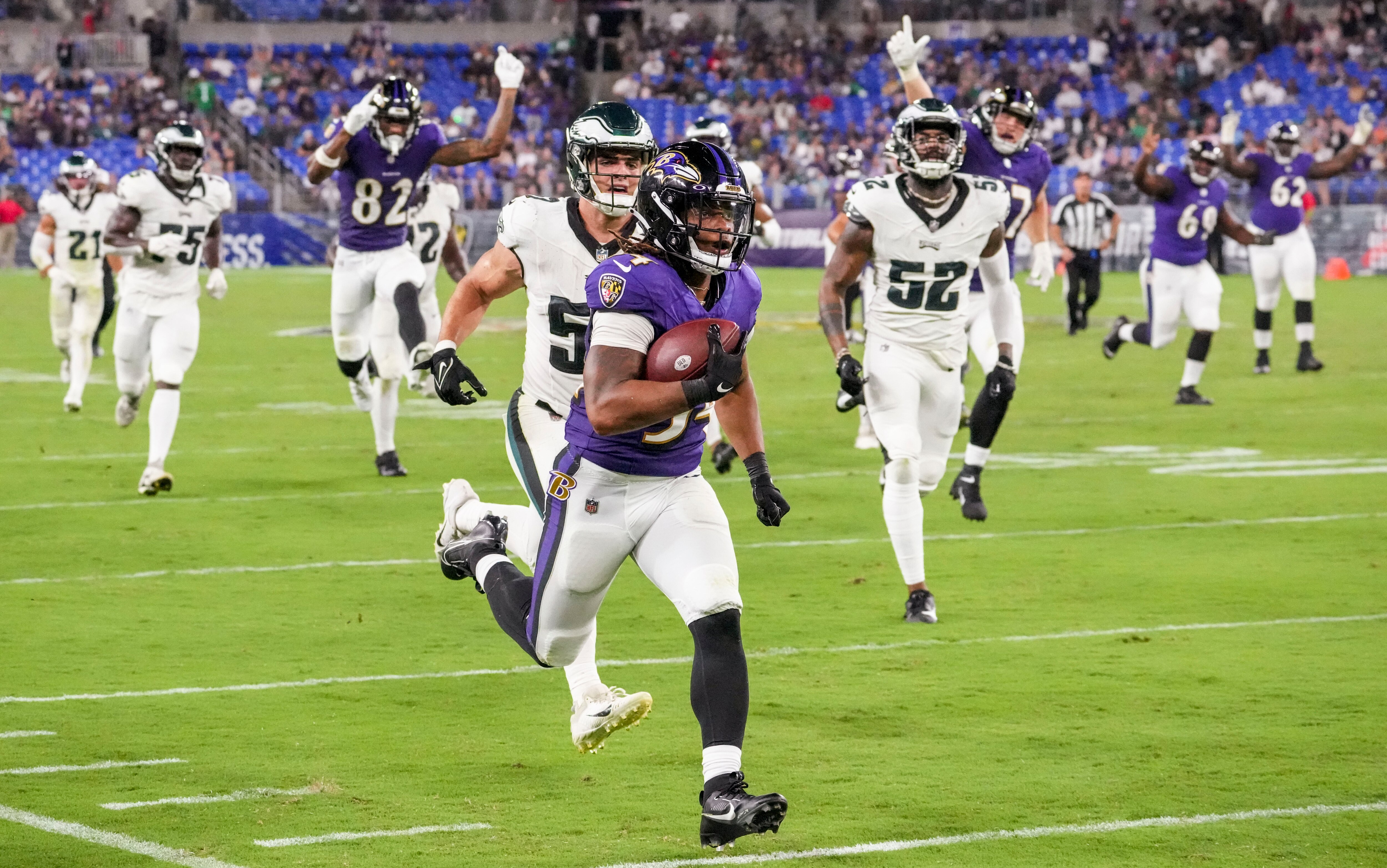 Baltimore Ravens running back Keaton Mitchell (34) take the ball down the field against the Philadelphia Eagles during a preseason game at M&T Bank Stadium on Saturday, August 12, 2023.
