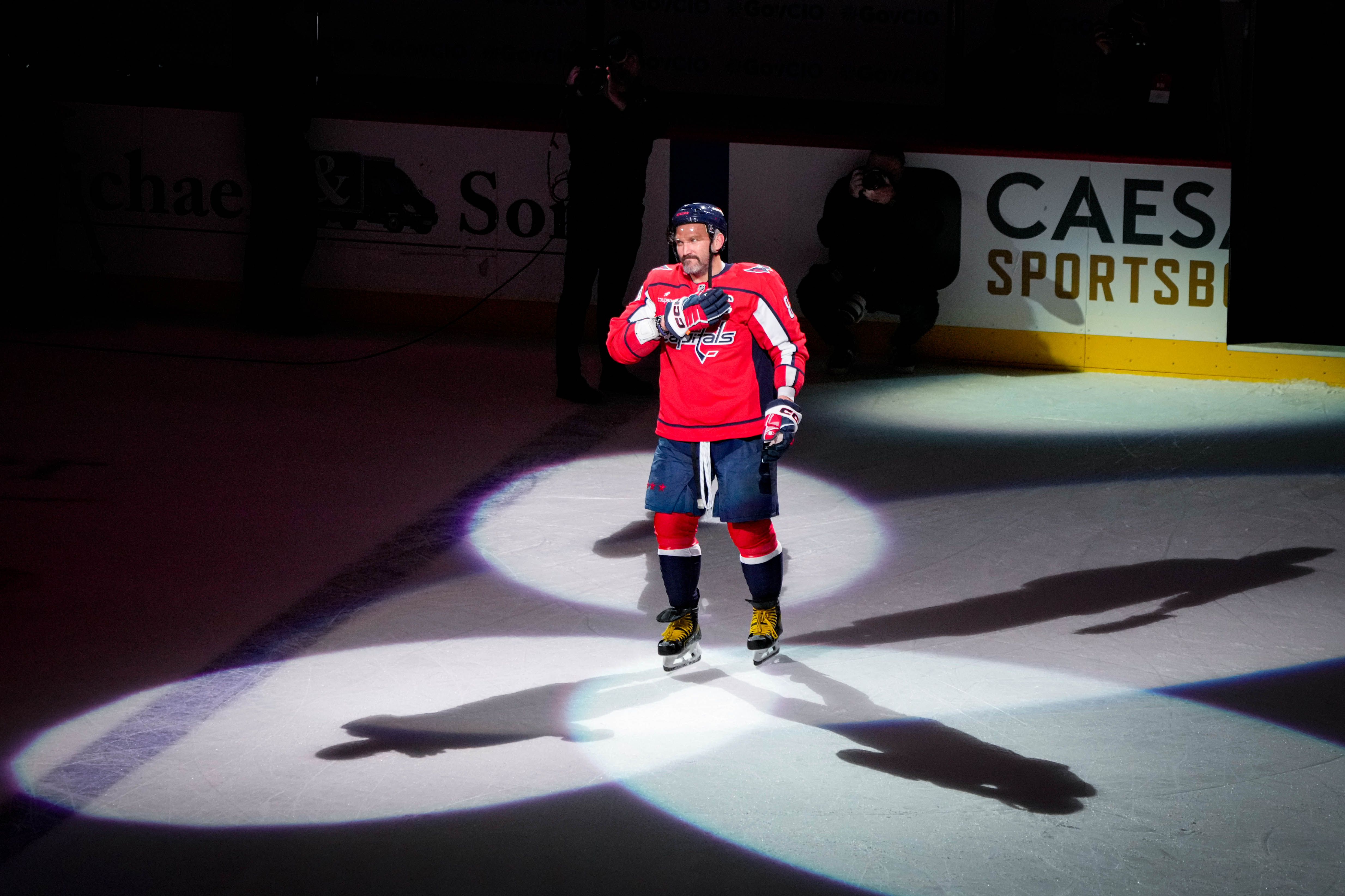 Washington Capitals left wing Alex Ovechkin places his hand over his heart as he is recognized as a Star of the Game after his team beat the Pittsburgh Penguins on Sunday.