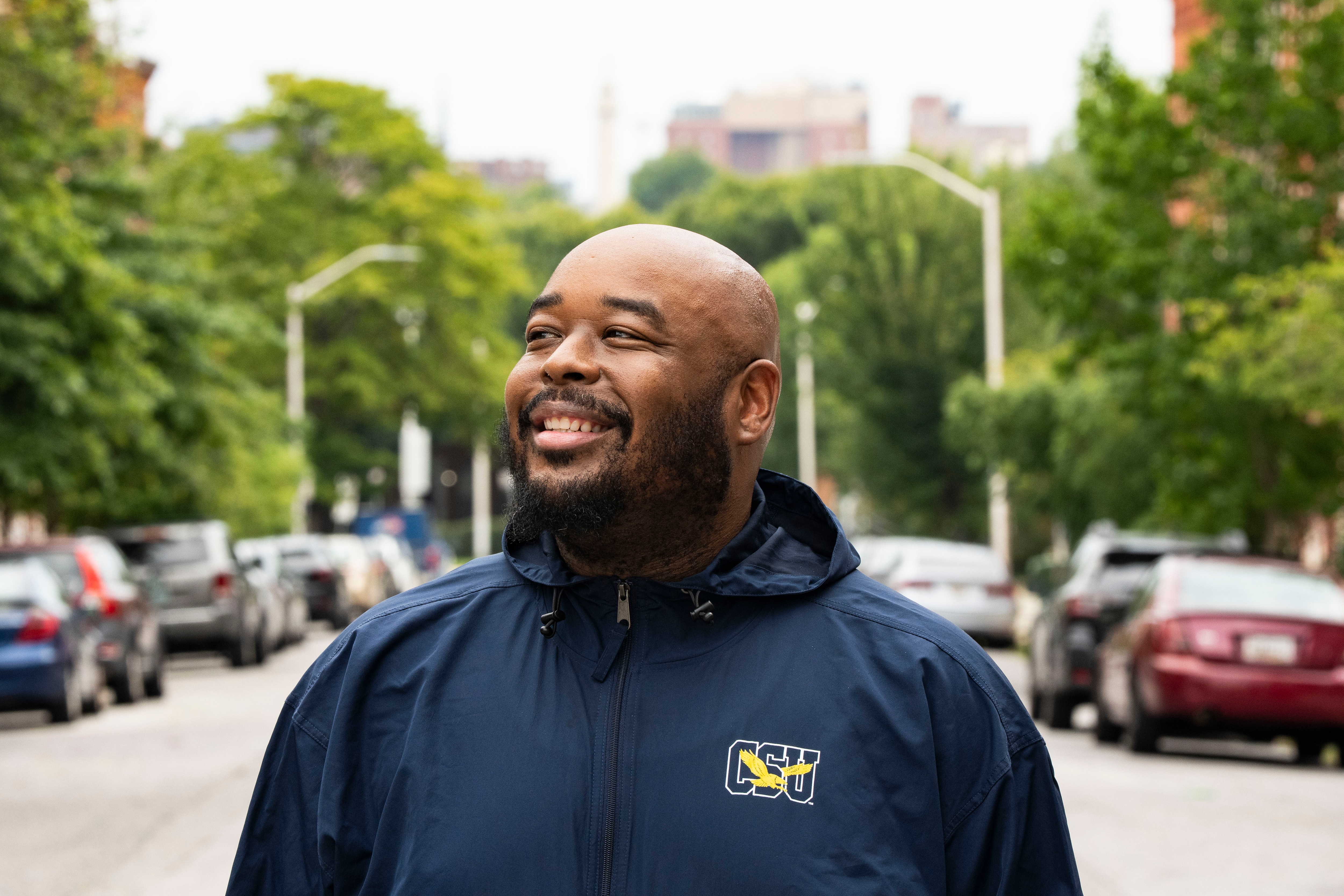 Christopher Robinson, a social work professor, in his new Baltimore neighborhood. Coppin’s program, launched in 2023 with state funding, has now helped faculty and staff buy six homes near campus. 