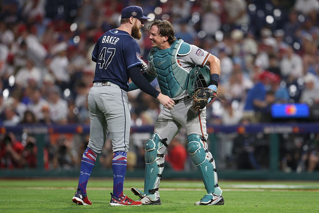 Bryan Baker of the Tampa Bay Rays and Adley Rutschman of the Baltimore Orioles embrace after the ninth inning of the 2026 MLB All-Star Game.